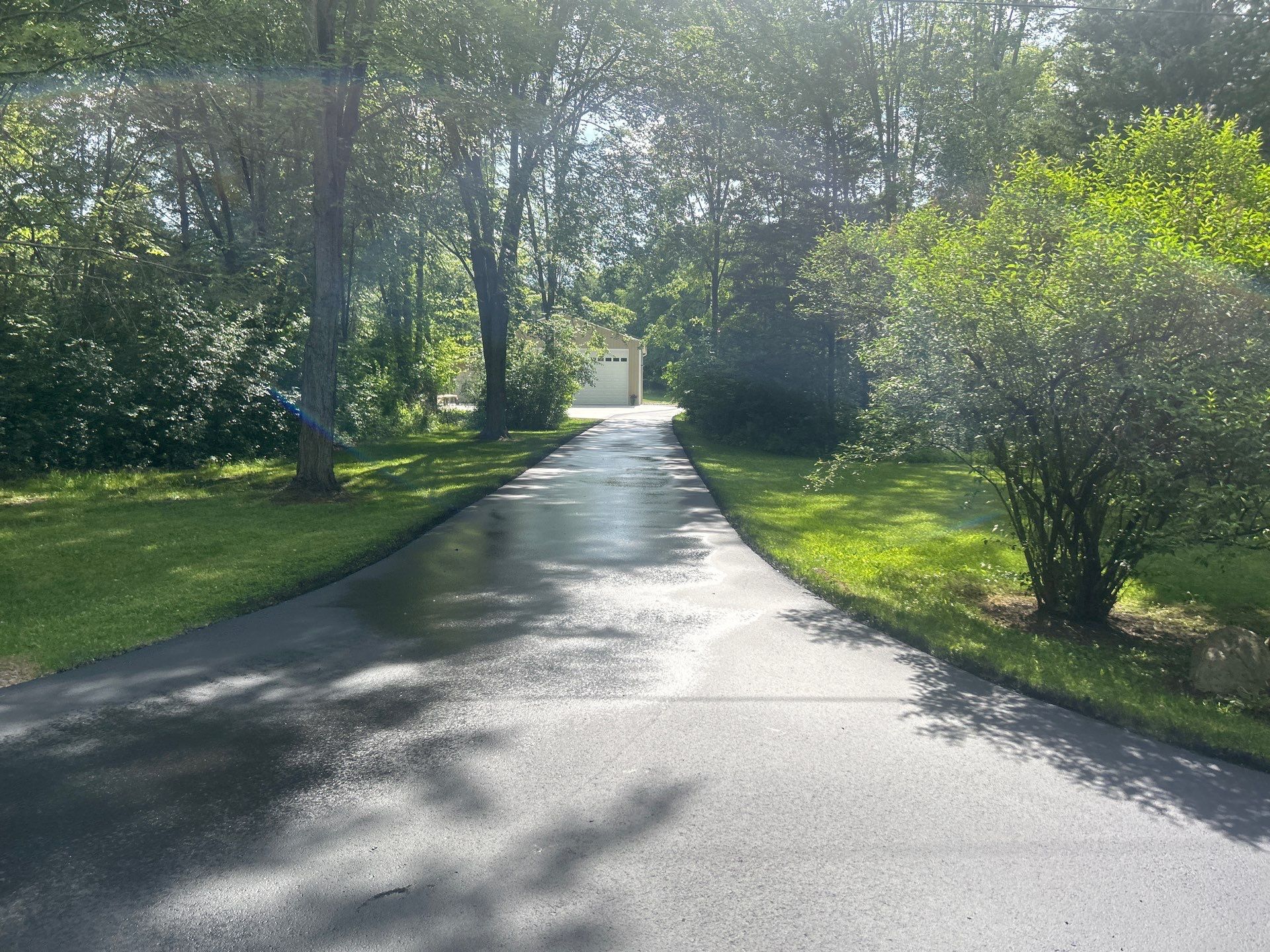 High end residential driveway by Quality Asphalt & Maintenance LLC