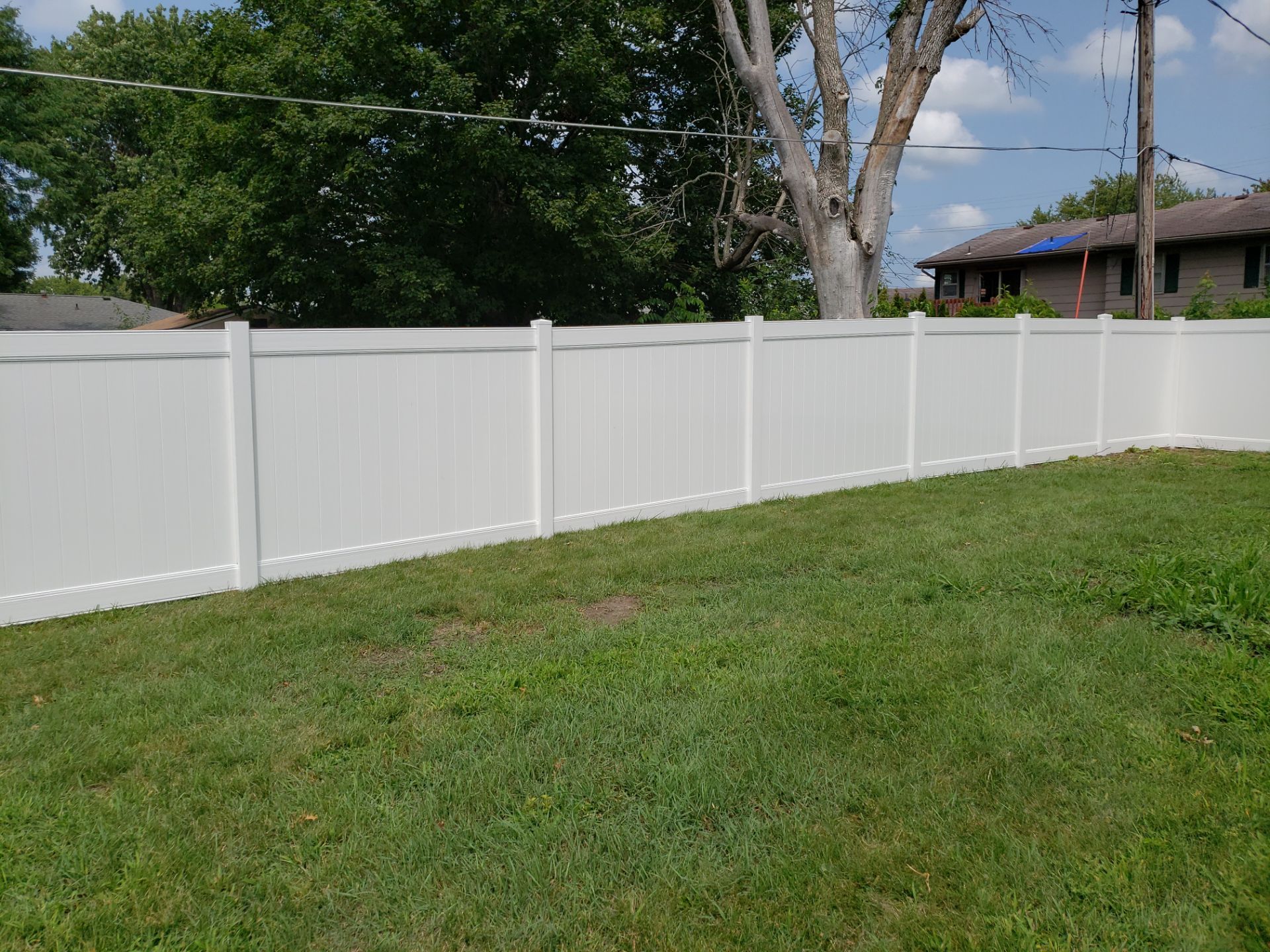 White Vinyl Privacy Fence Installation in Grundy Center by Perfect Picket Fence and Stain