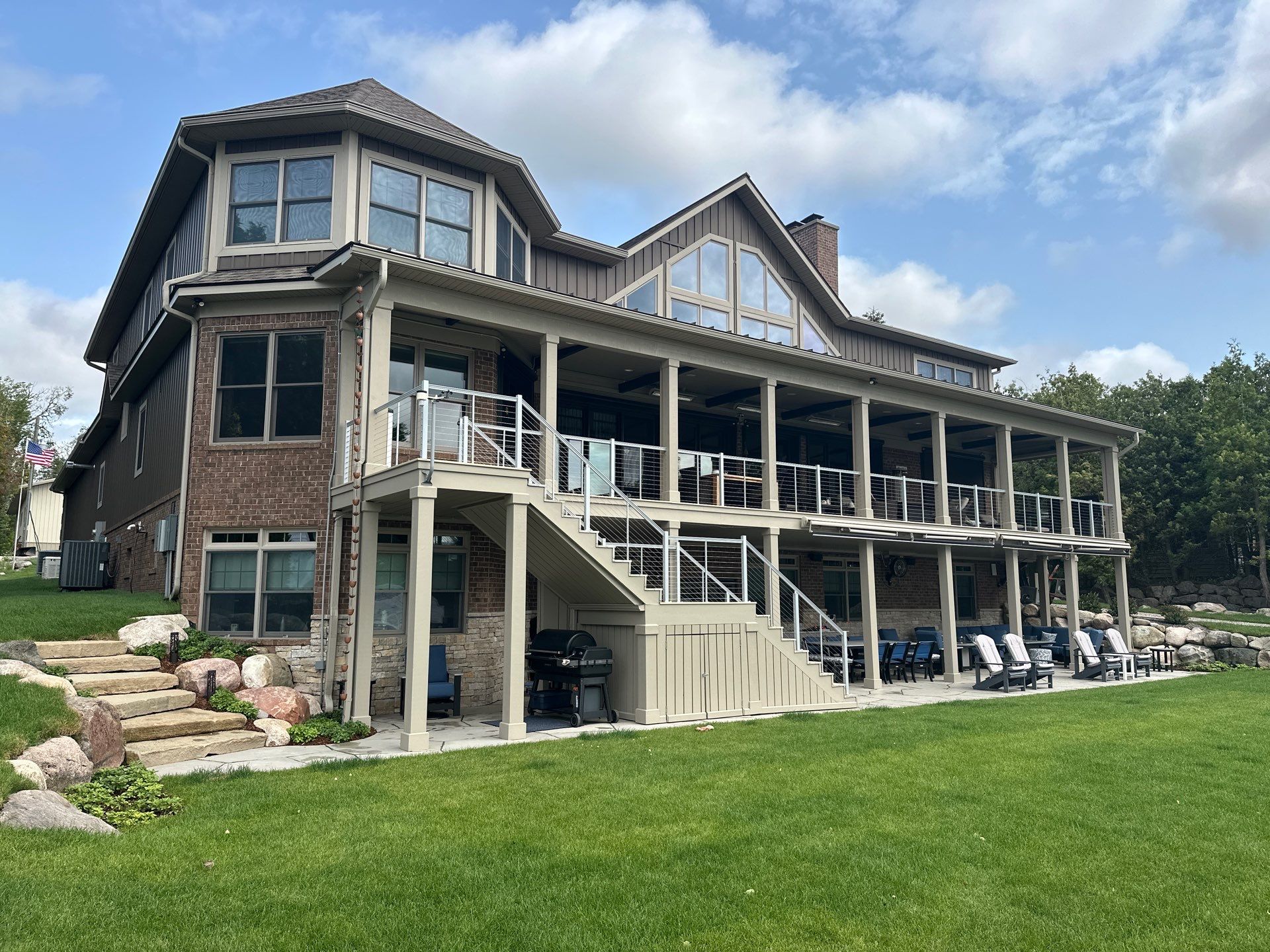 Custom Underdecking System and Outdoor Kitchen in East Jordan by Rainbow Seamless Systems