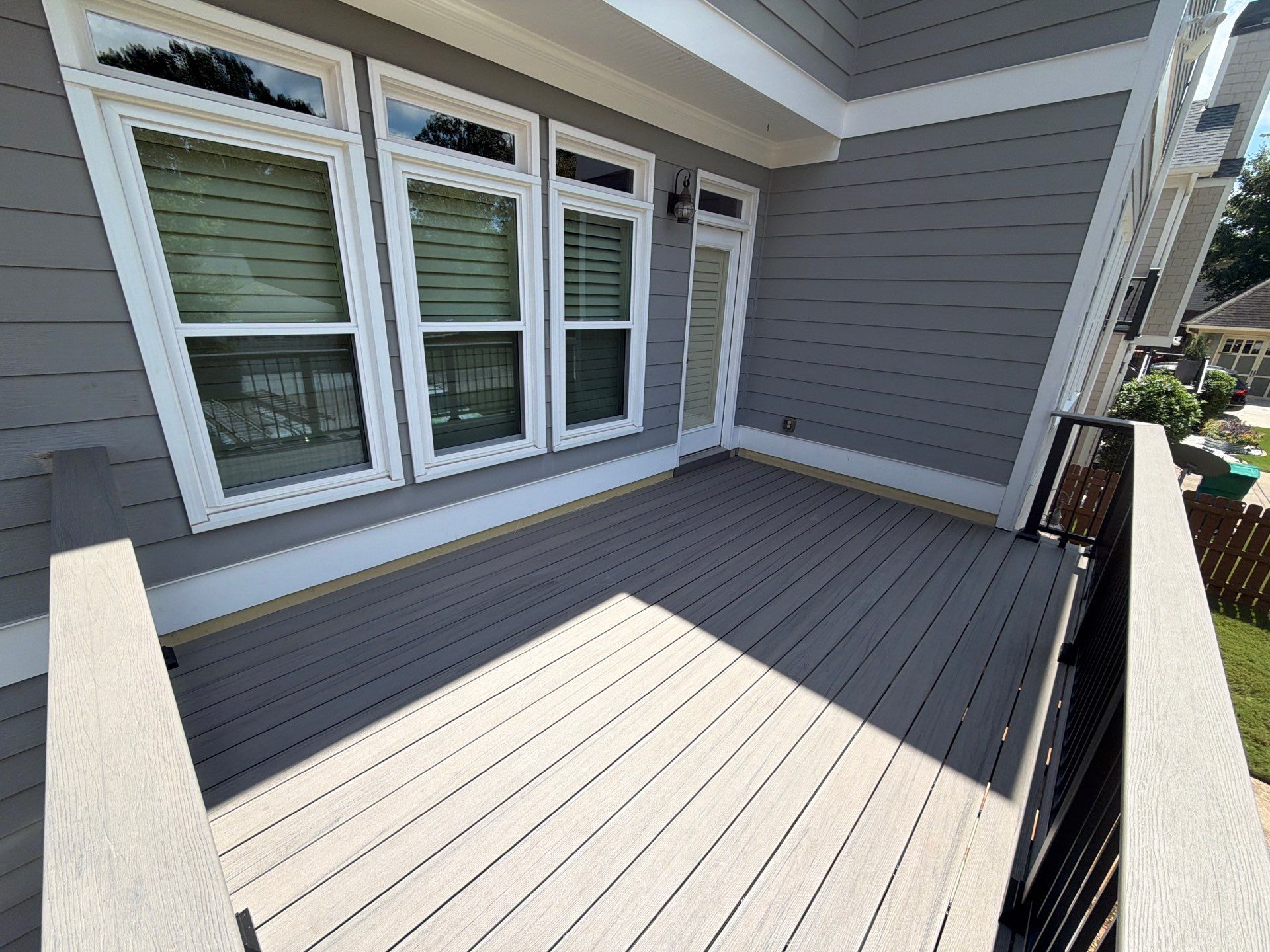 Elevated Composite Deck Replacement with Metal Railings in Smyrna by Swift Home Renovations 