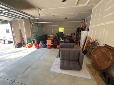 Hudsonville Garage Renovation Featuring Finished Drywall and Flake Epoxy Floors