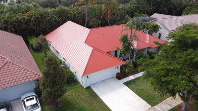 Residential Roofing Installation using 1" Nail strip metal roof