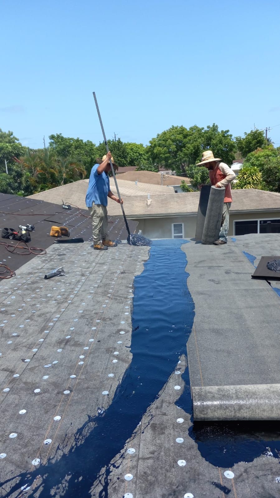 Standing Seam Metal & Flat Re-Roof using 1.5" Nail Strip 24ga Black Matte Kynar Coated Standing Seam Metal Panels by Morton Roofing, Inc.