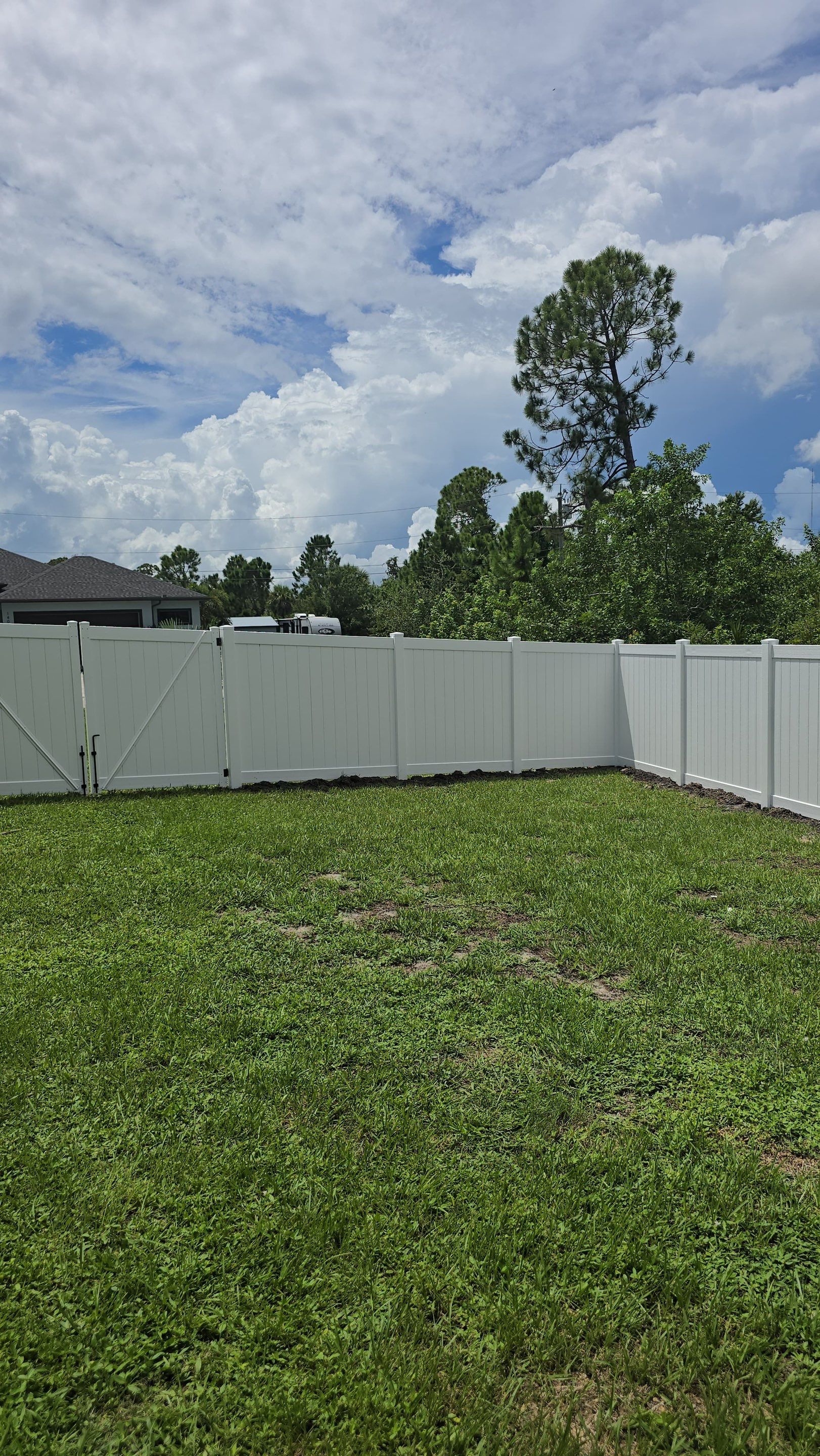 White Vinyl Privacy Fence Installation in Port Charlotte Florida by True Fence LLC