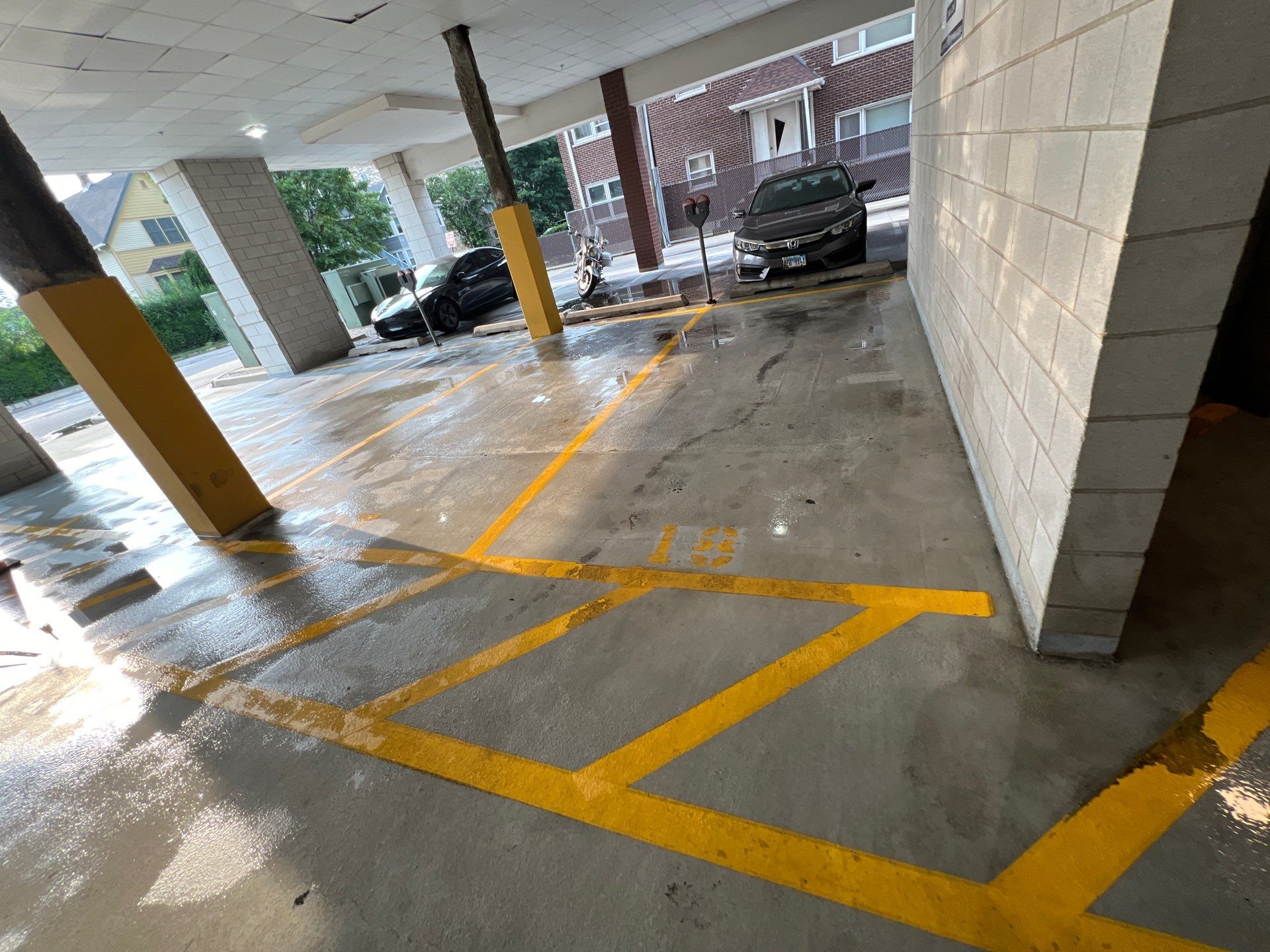 Parking garage using Hot water by Northern Power Washing LLC.