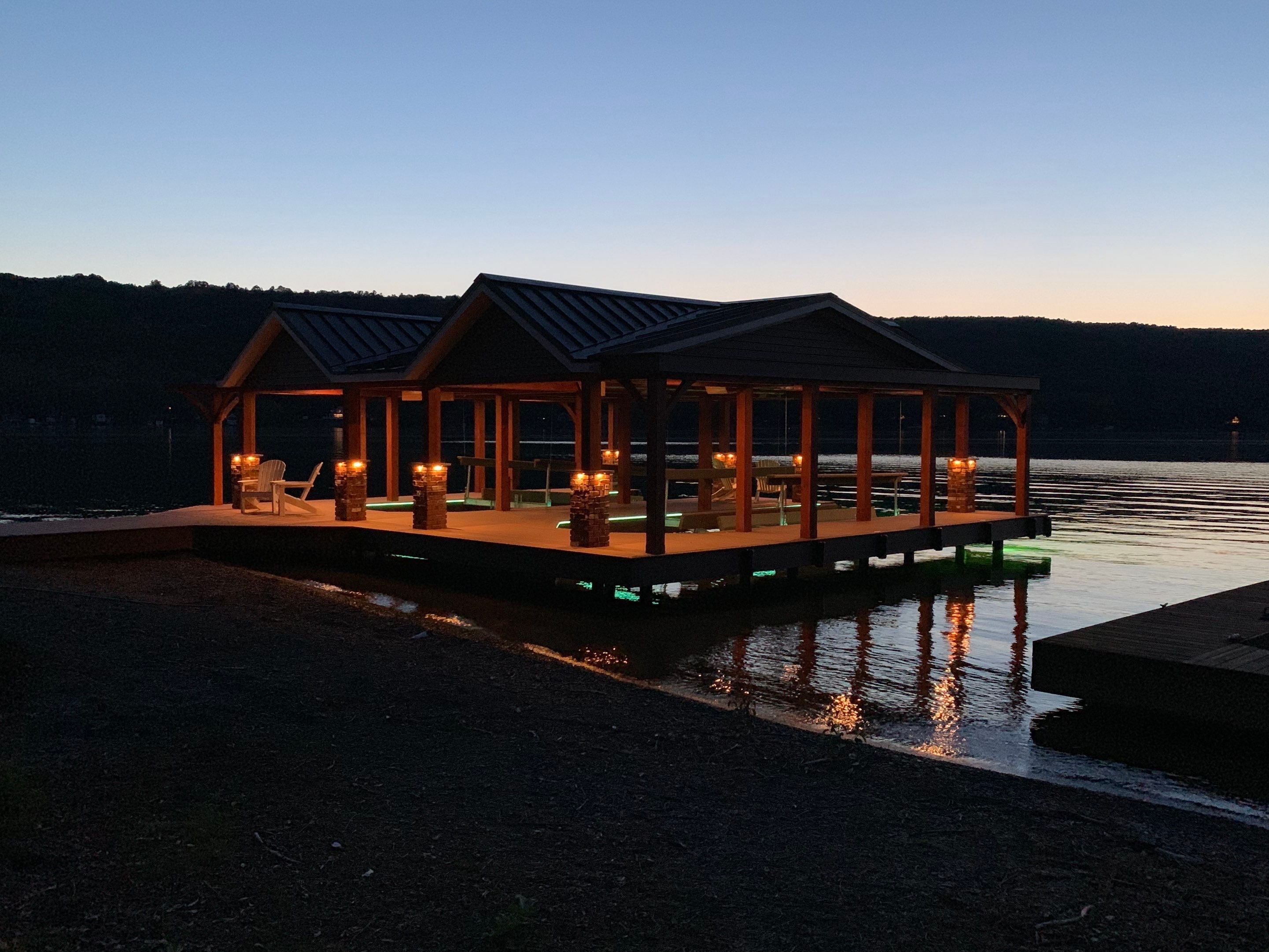 Custom Timber-Framed Boat Dock with Multi-Color LED Lighting on Keuka Lake, New York by Outdoor Lights + Shades
