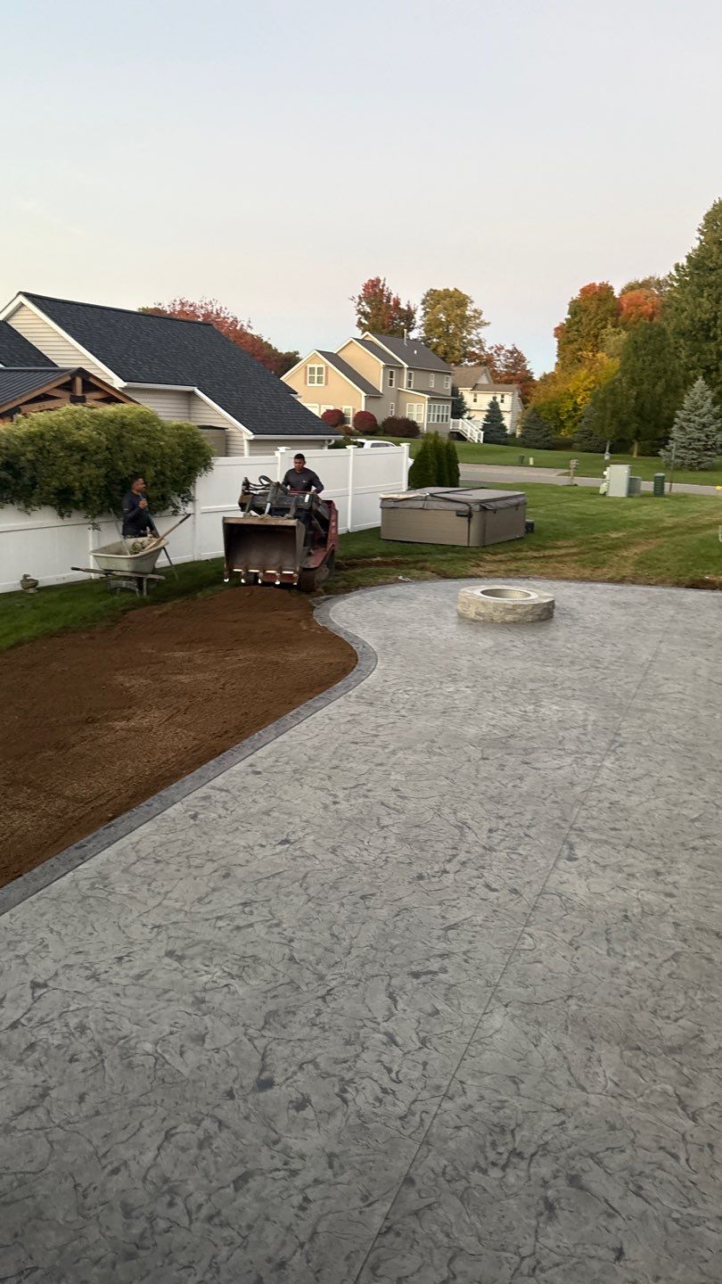 Oxford slate stamped concrete patio  by NG Masonry & Construction LLC