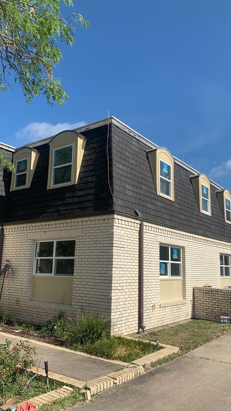 Mansard Charm by Bayfront Roofing and Construction