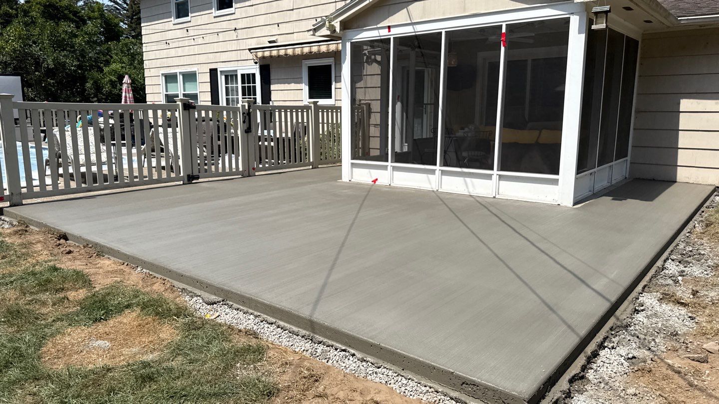 Broom finished concrete patio and sidewalk  by NG Masonry & Construction LLC