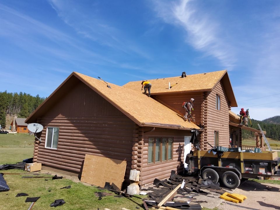 Hill Country Guest Ranch using Steel Roofing, Gutters, Log Cabin Staining by Lightning Exteriors
