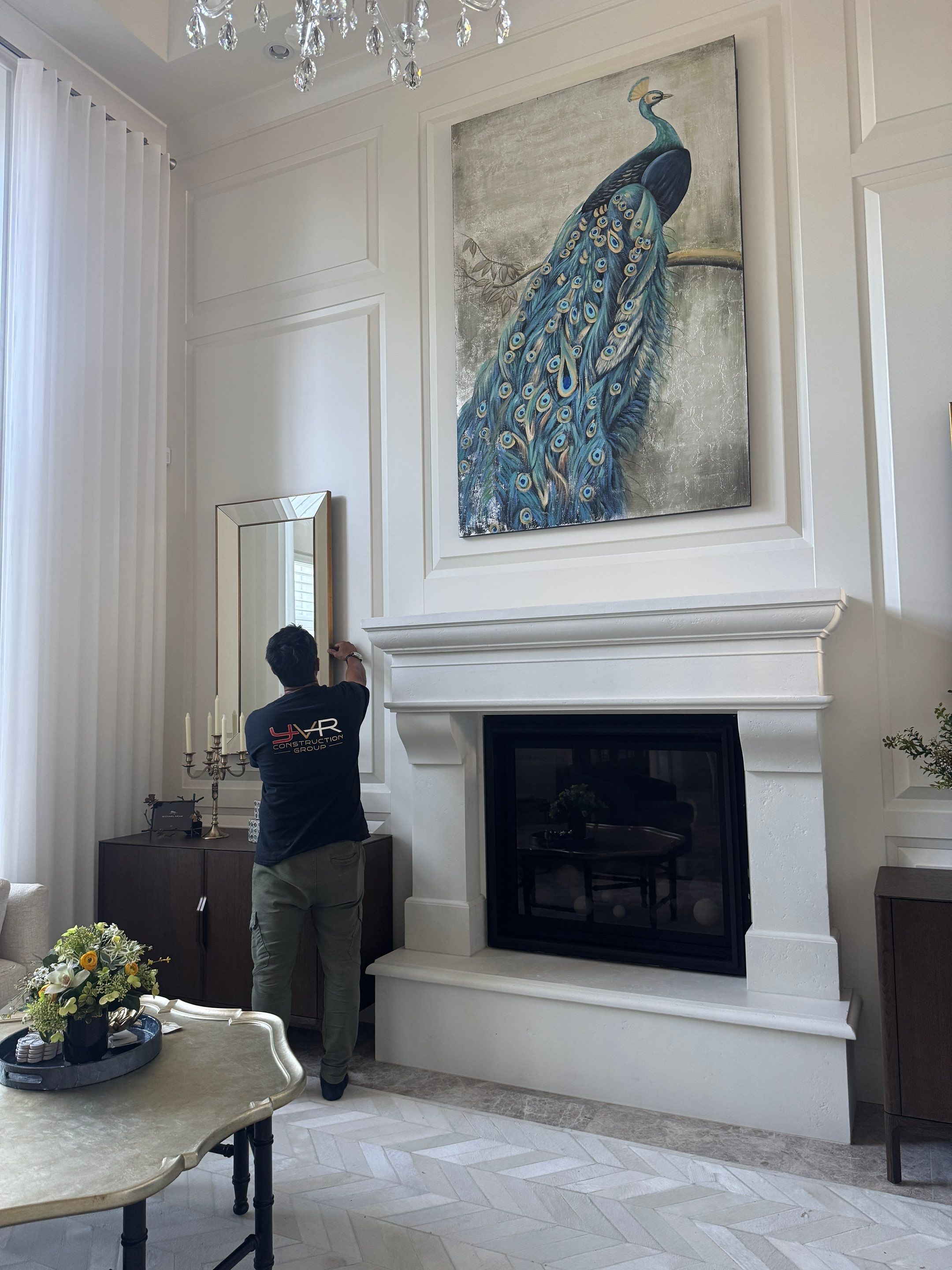 Professional Hanging of Mirrors & Art in a Designer Home by YVR Construction Group