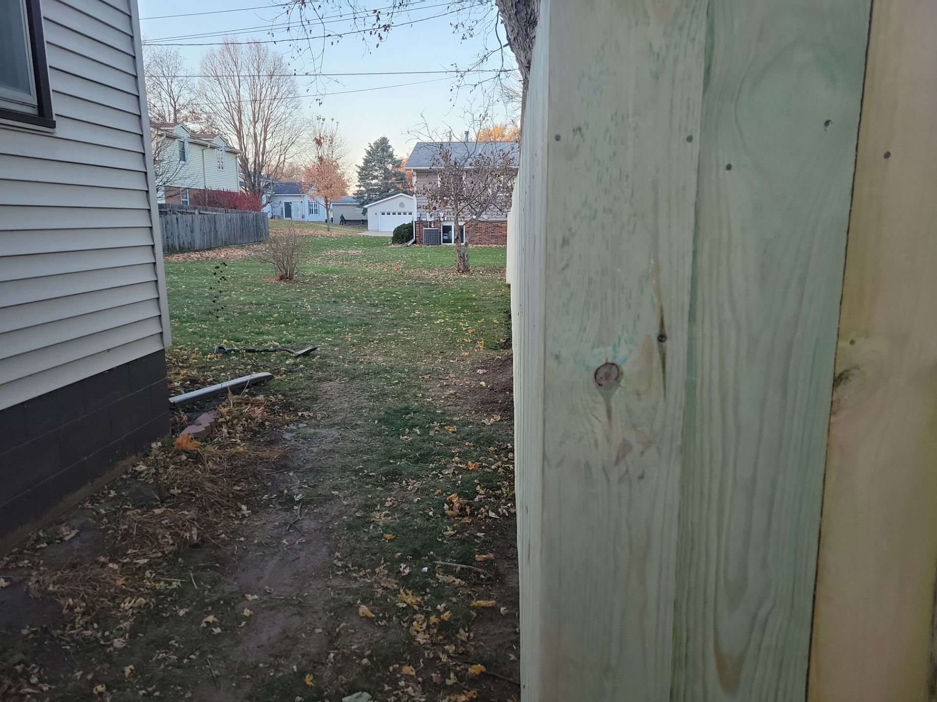 New Pressure-Treated Wood Privacy Fence and Gate in Charles City by Perfect Picket Fence and Stain