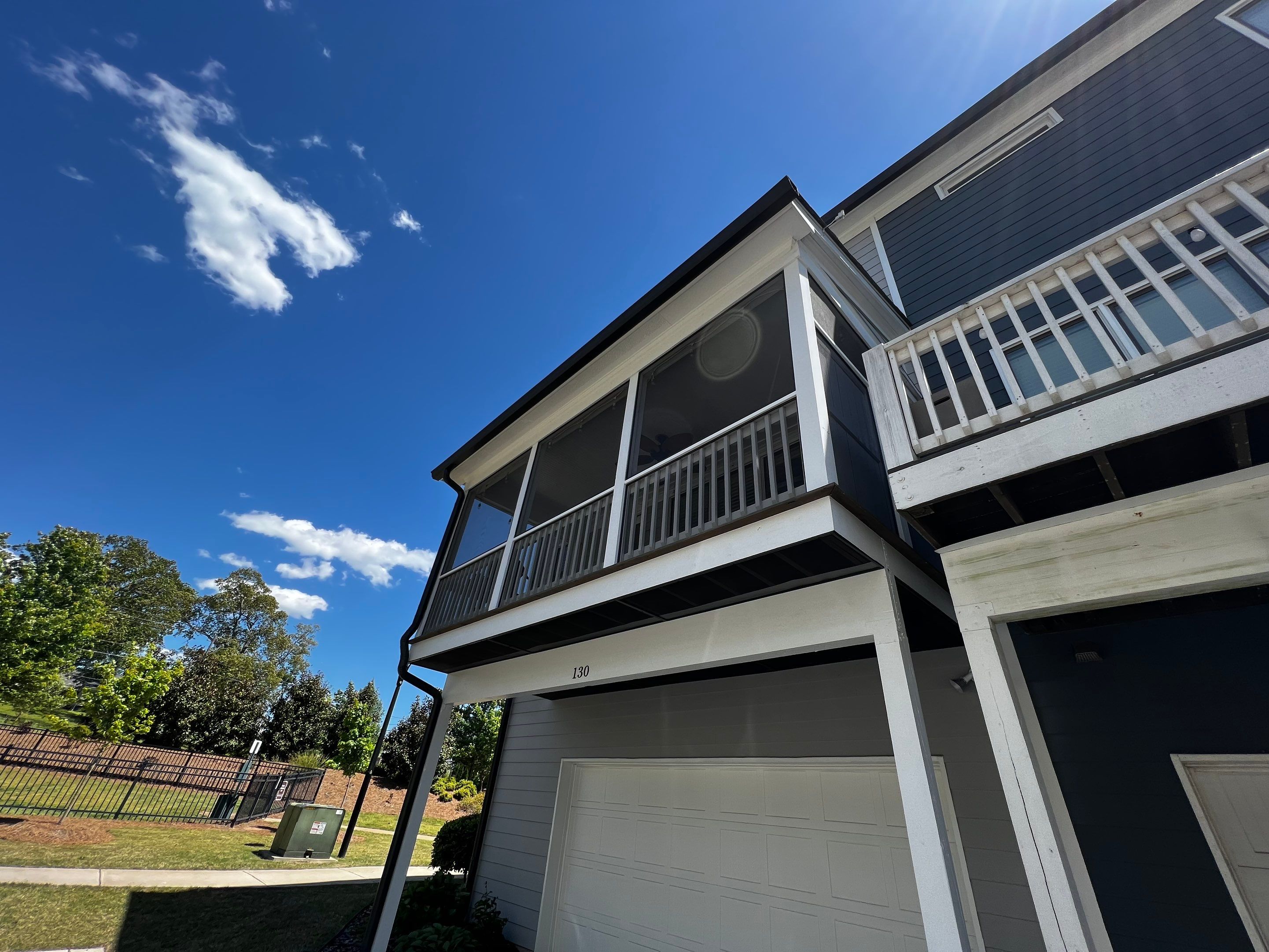 Custom Screened-in Porch Addition Above Garage in Woodstock by Swift Home Renovations