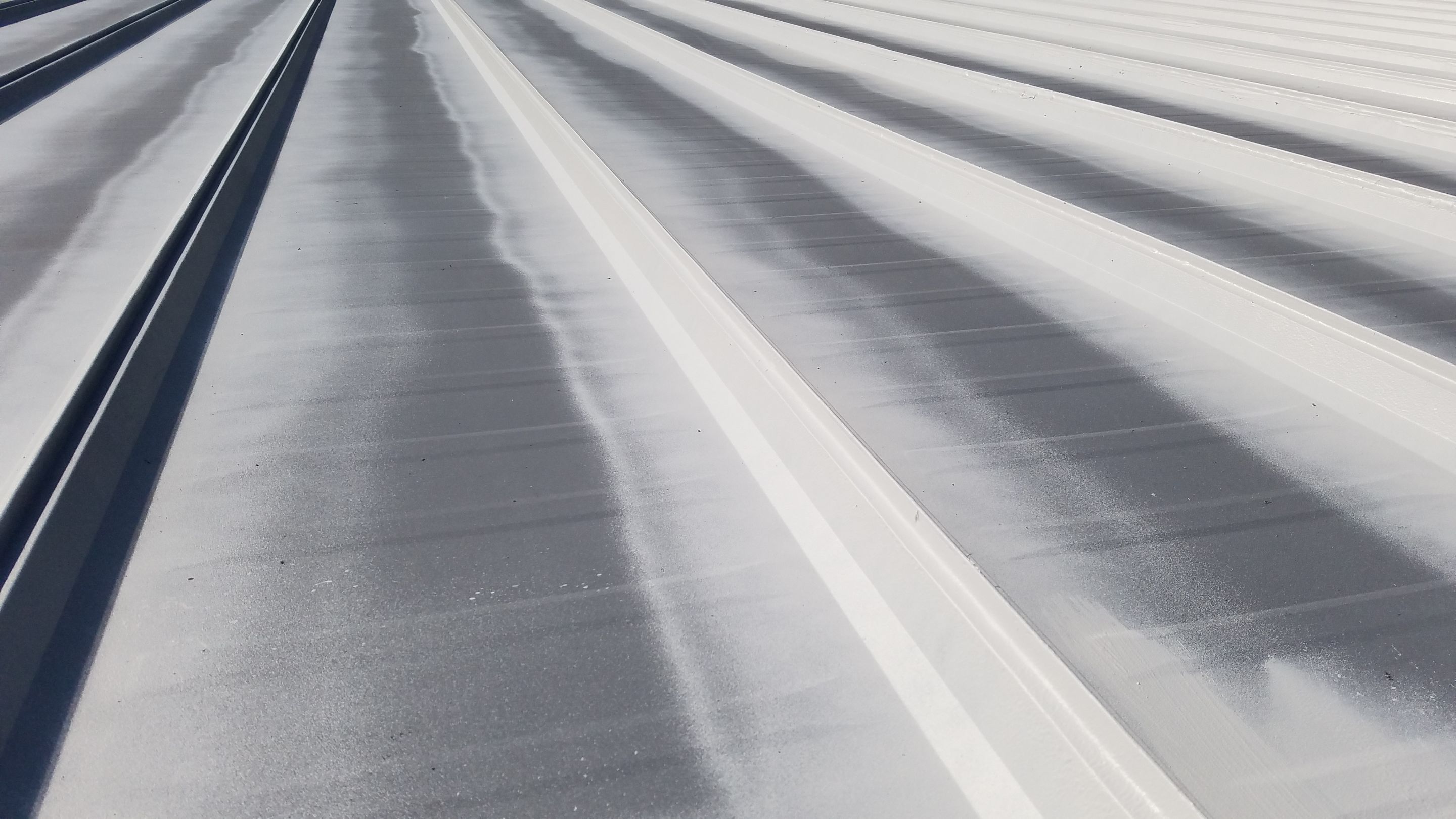 Commercial Metal Roof Coating by Gold Star Roofing LLC