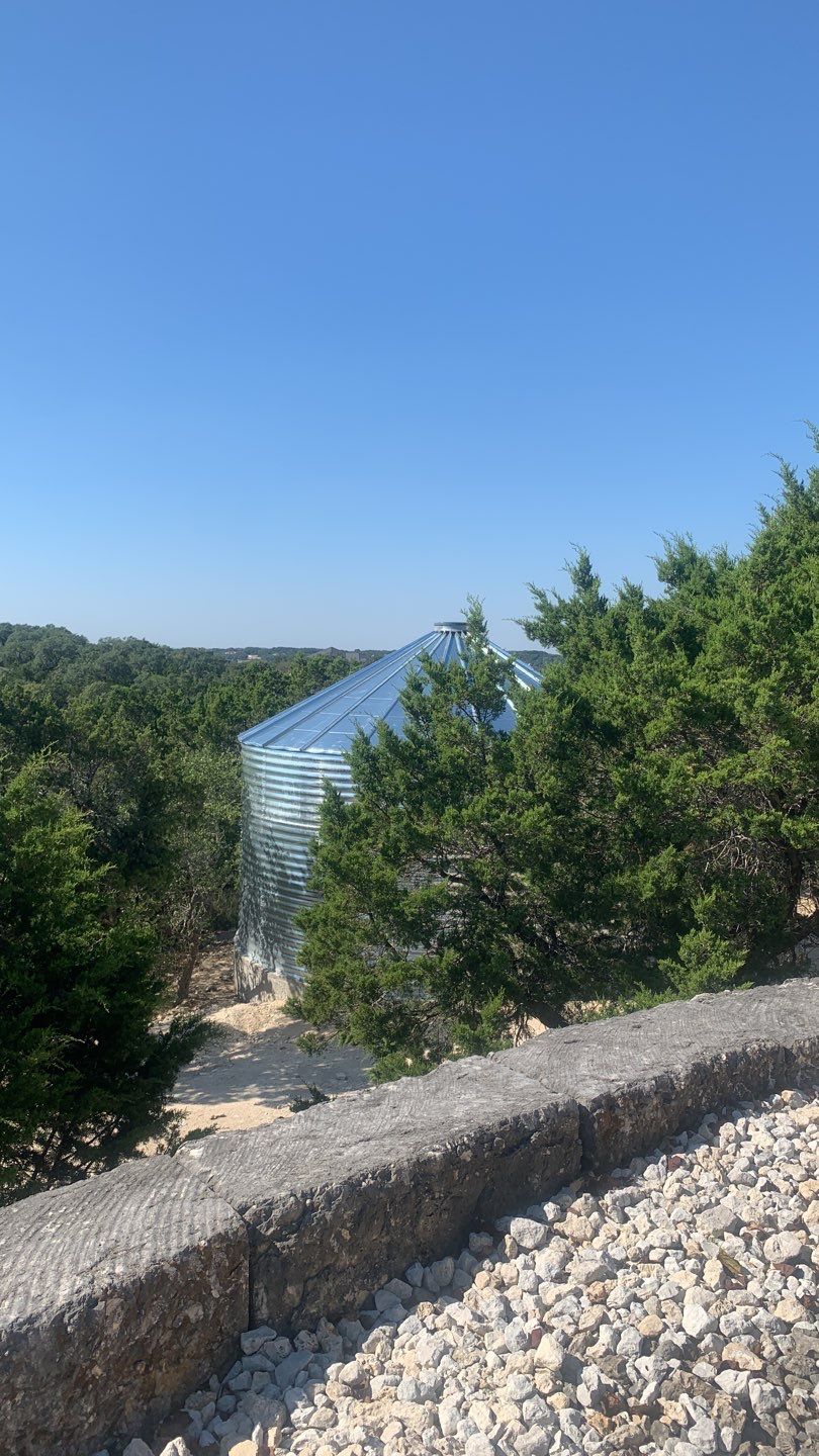 Cliffside installation for primary water source. by Hill Country Rain Water