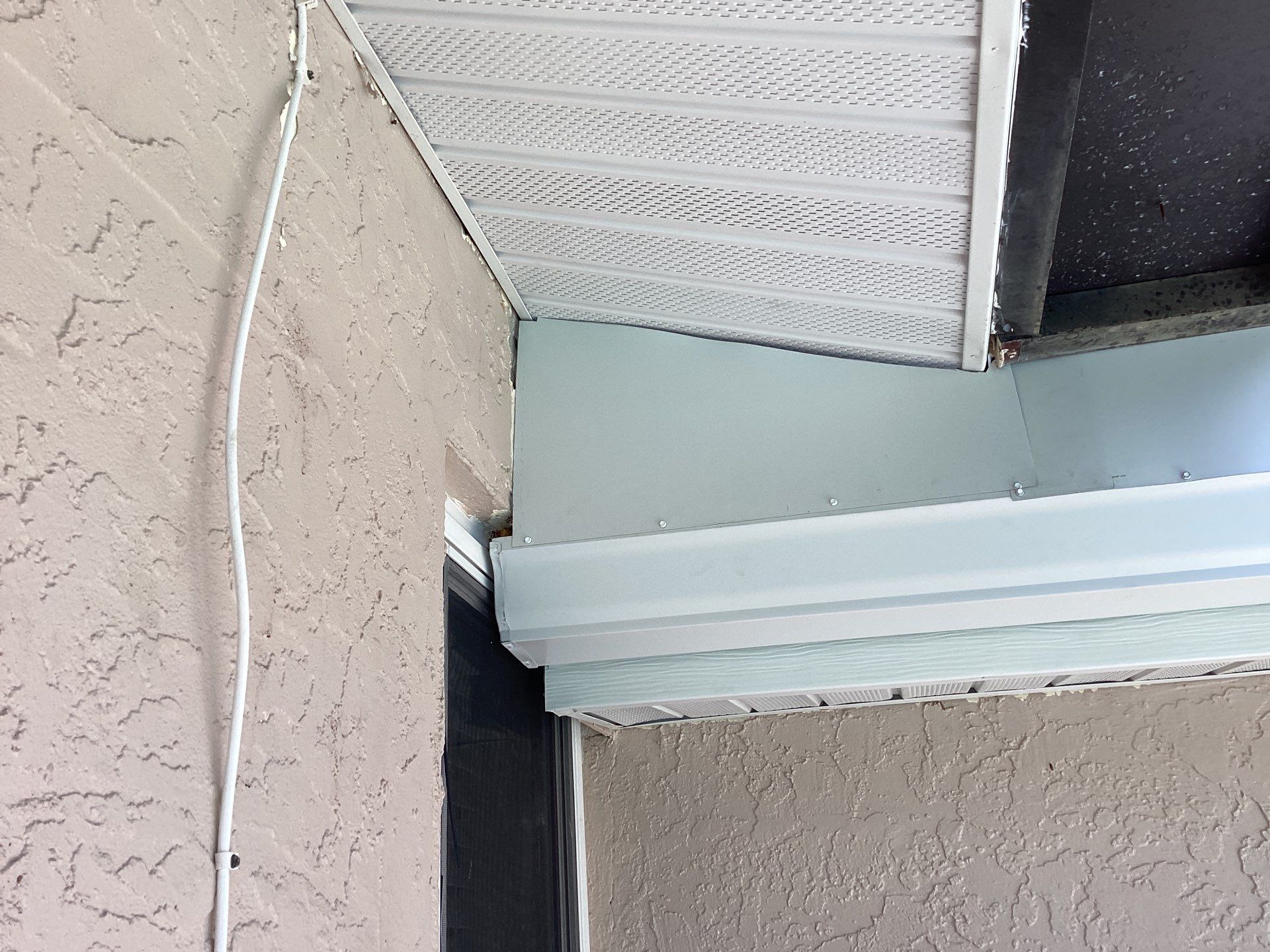 White Seamless Gutters and Splash Guards in Fort Myers FL by Gutter Professor by Gutter Professors