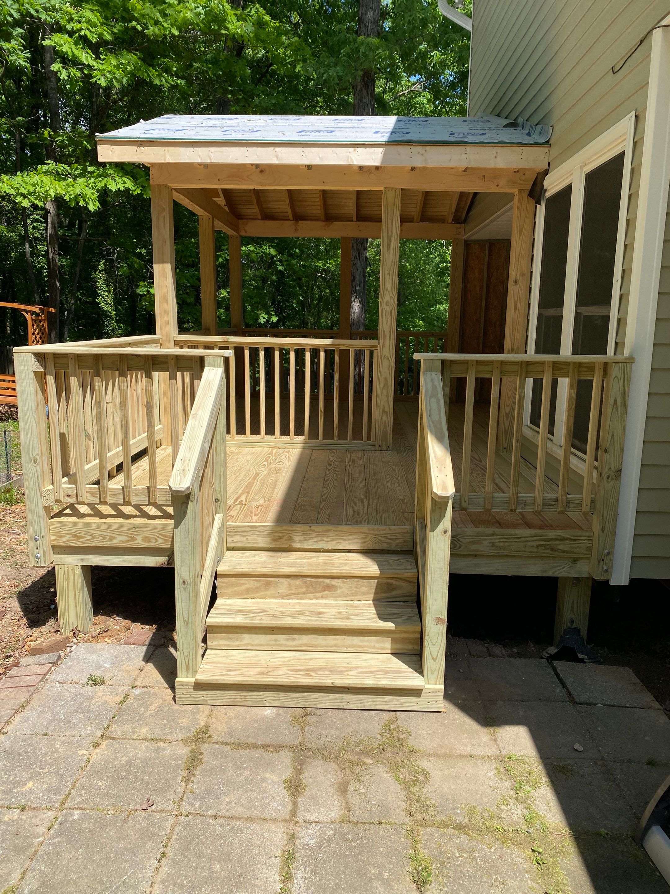 Custom Screen Porch Addition with Gabled Roof and Open Deck by The Remodeling Company