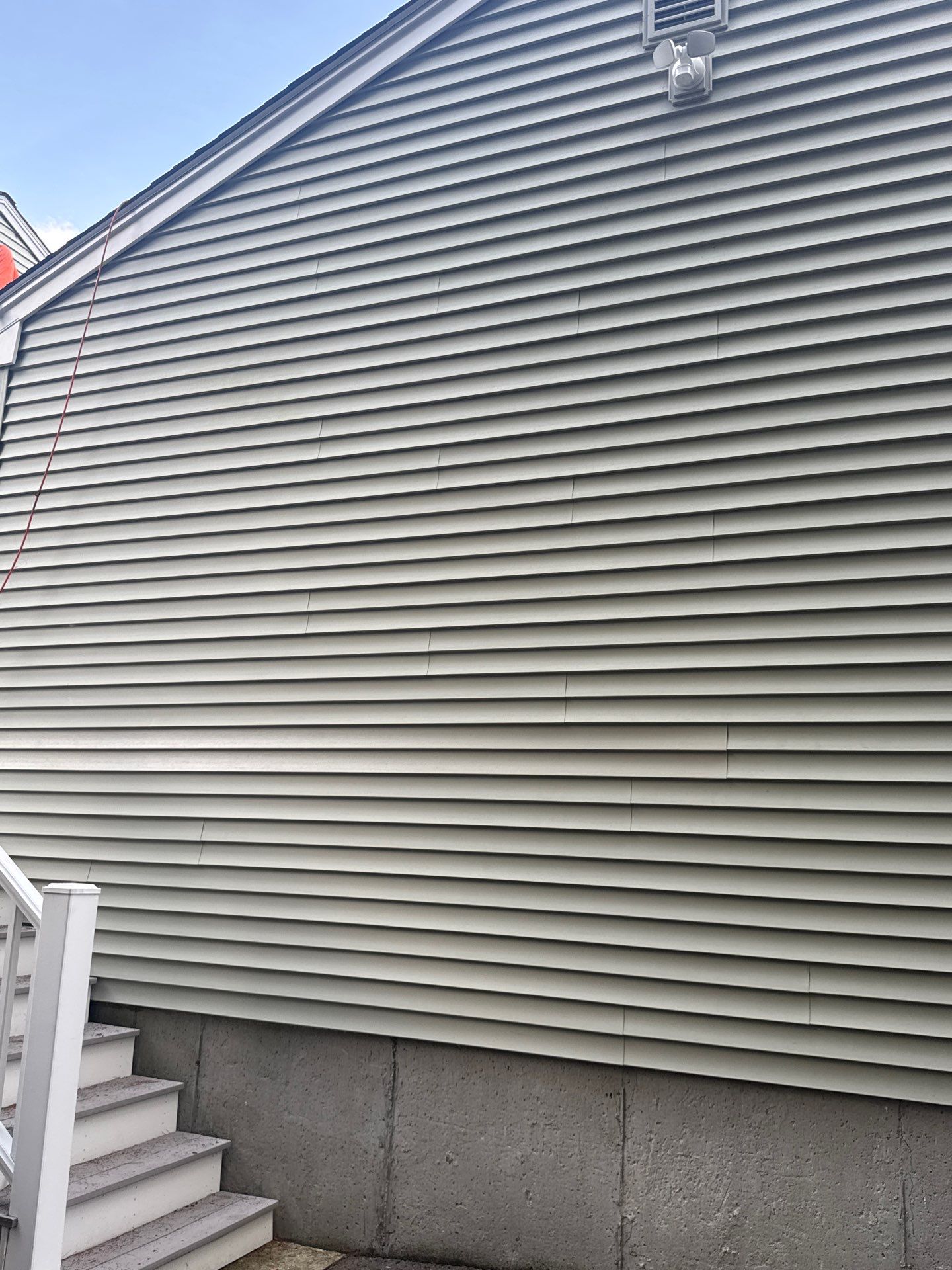 Complete Roof Replacement with Chimney Flashing, Gutter Guard System, and Vinyl Siding Repairs by Mighty Dog Roofing of Greater Middlesex County