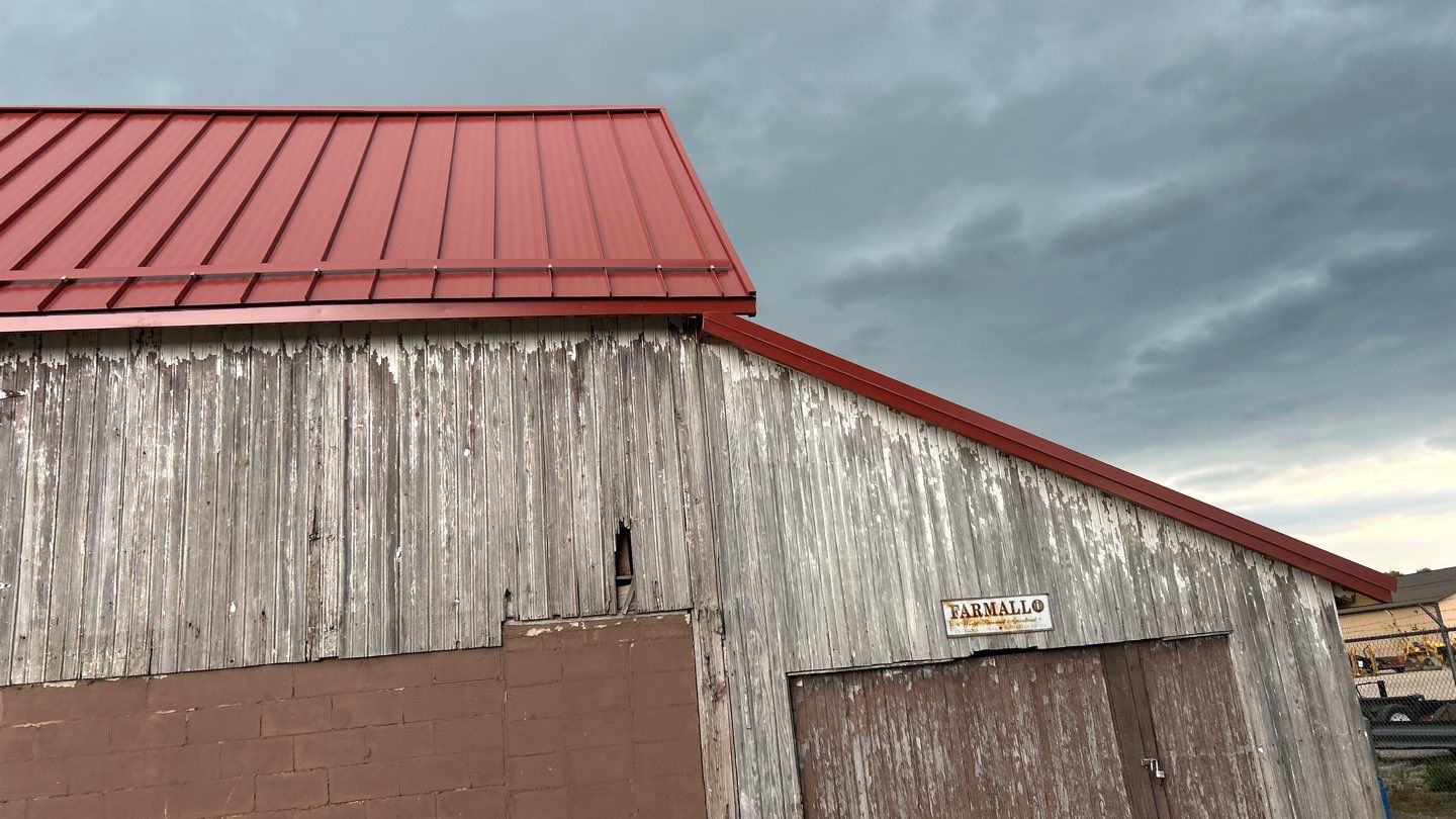 Residential Roofing Installation using Standing Seam Metal - Barn Red by RoofX 