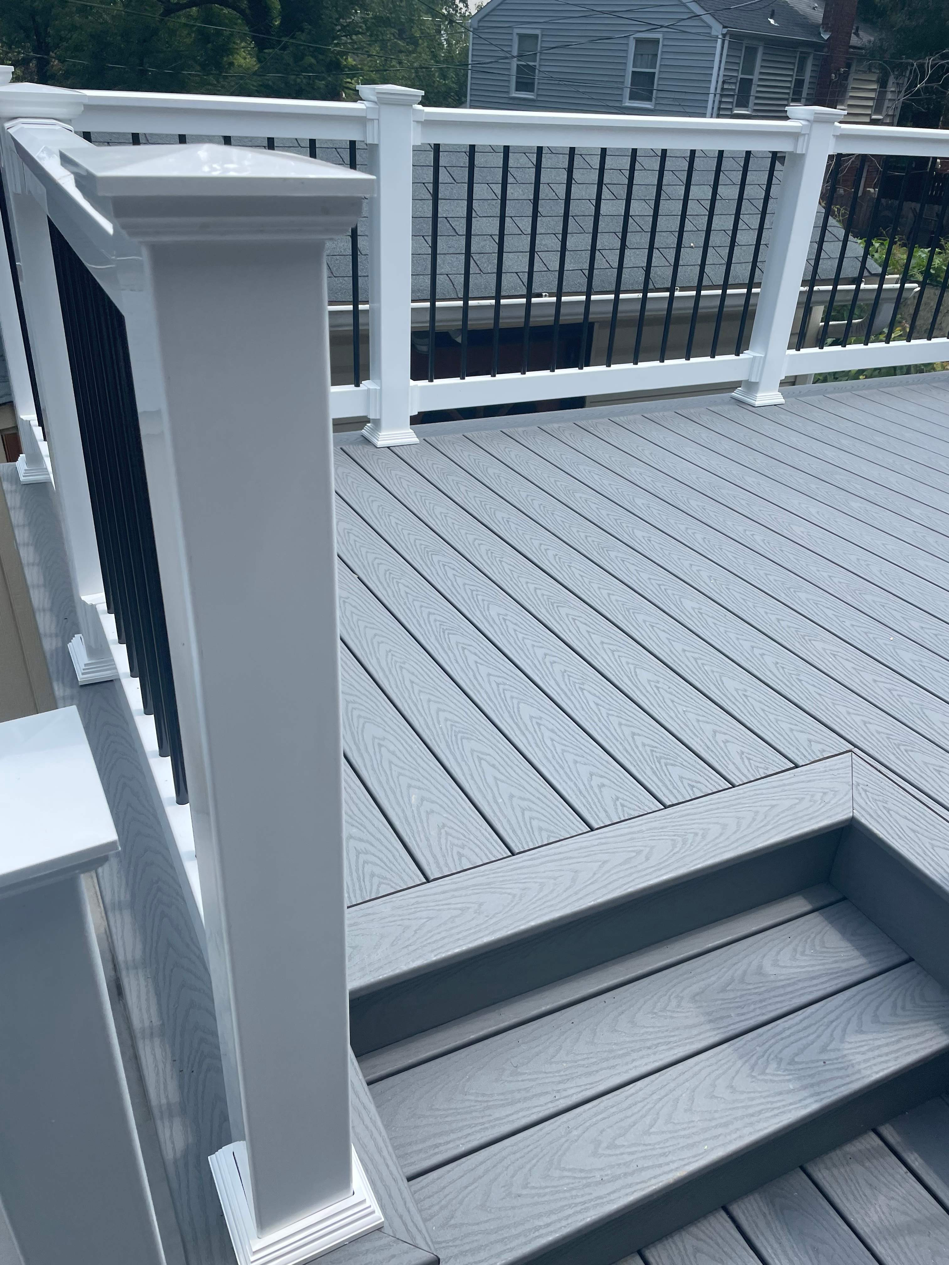 Deck resurfacing, railing replacement and concrete resurfacing by Fairfax Contractors, LLC