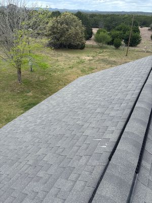 Architectural asphalt shingle roof with a ridge vent.