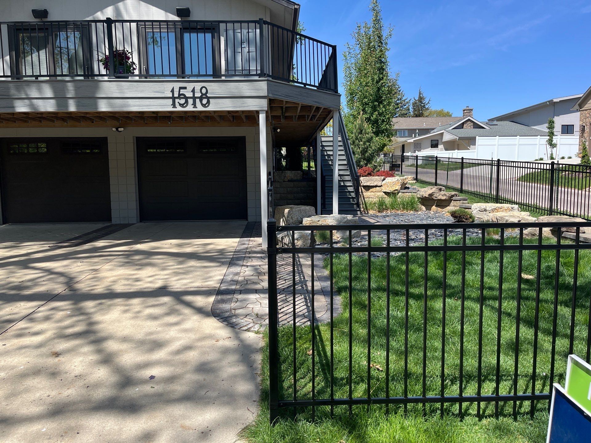 Ornamental Black Metal Picket Fence Installation in Cedar Falls by Perfect Picket Fence and Stain