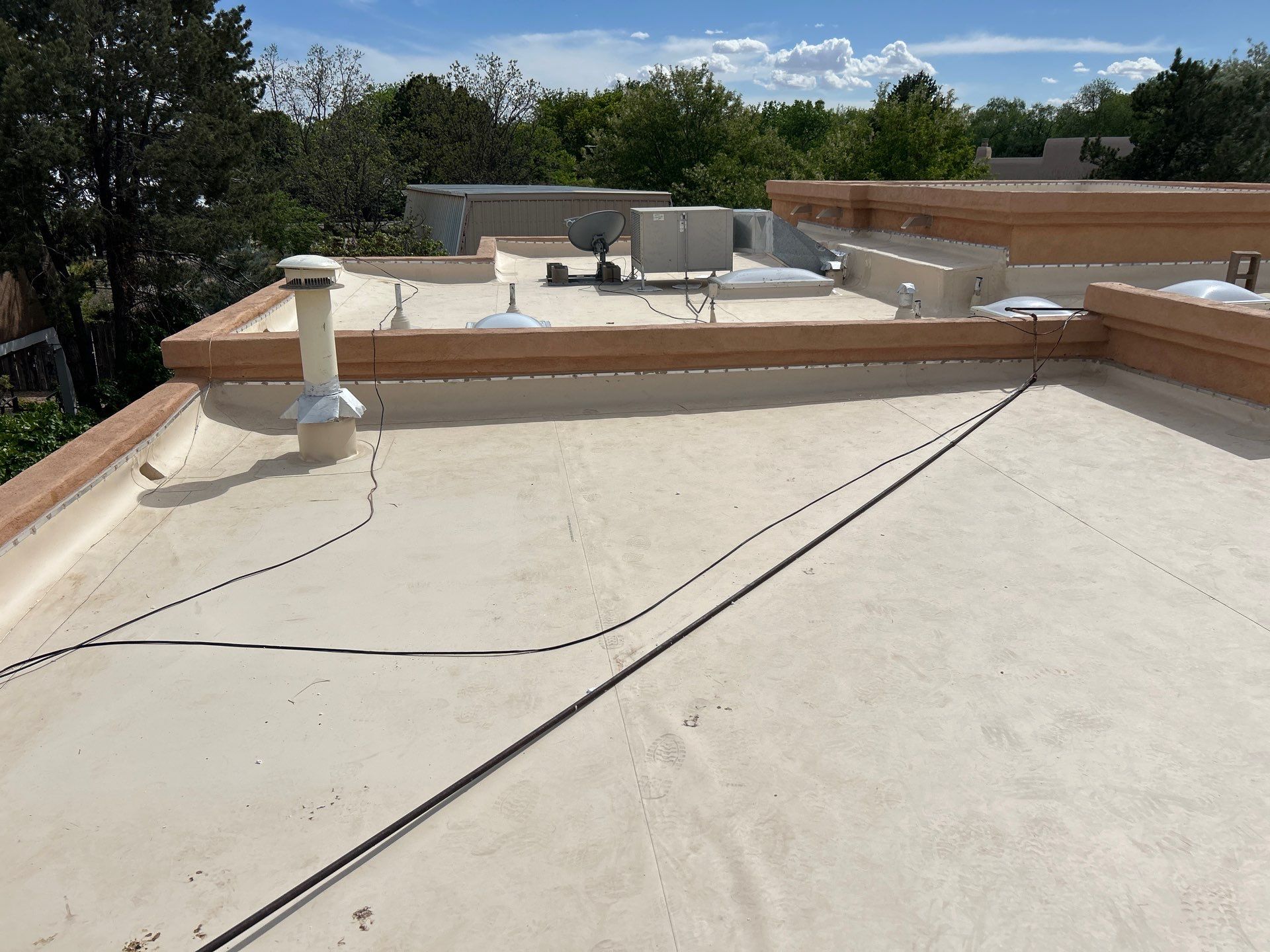 Residential TPO Flat Roof Replacement and Skylight Installation in Albuquerque by Doyle Roof Masters Inc