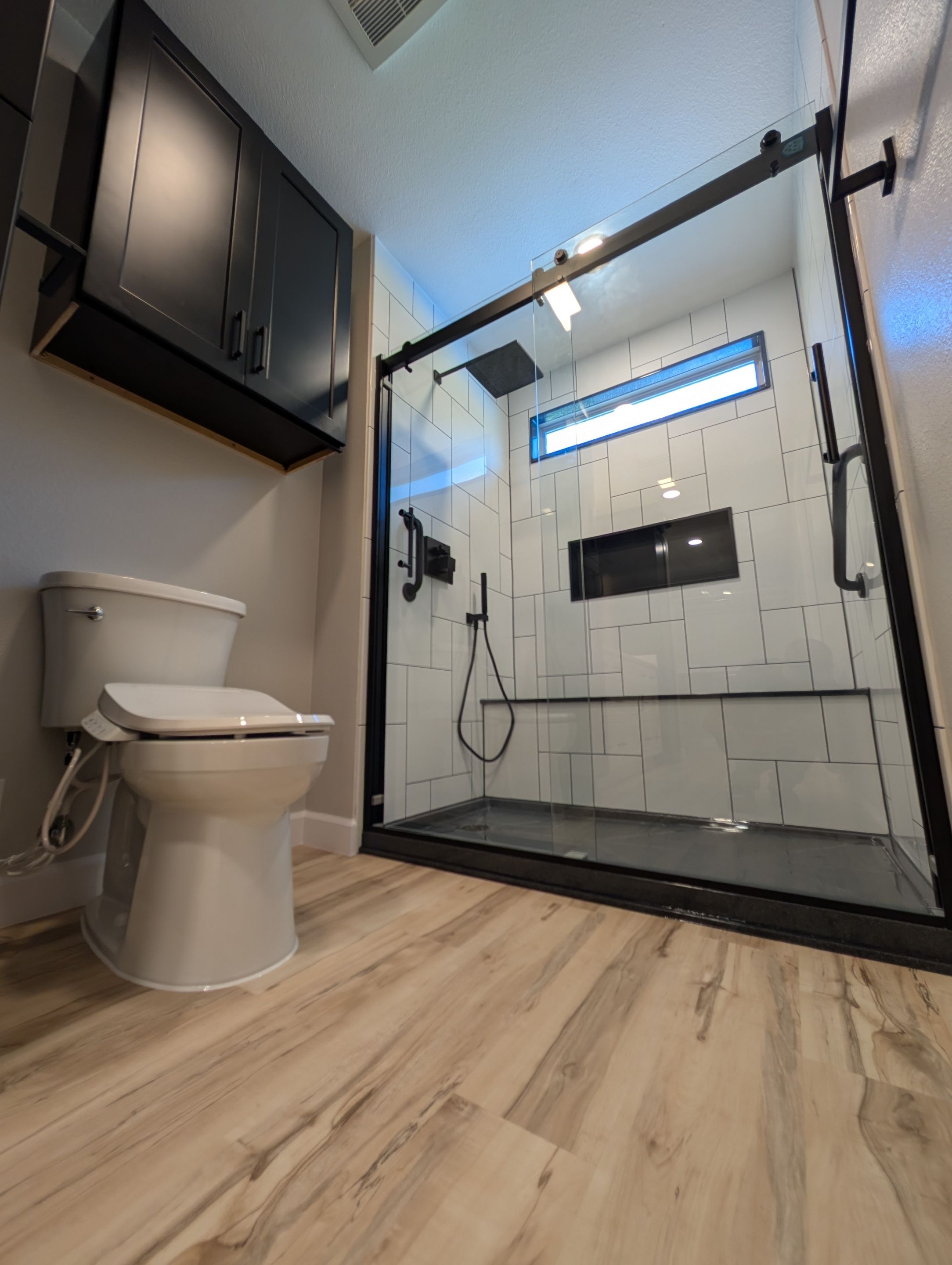 Universal City Tub-to-Shower Conversion with Built-In Bench and Backlit Mirror by Legacy Bath and Kitchen 