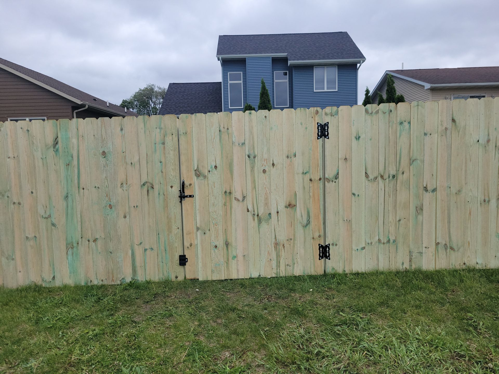 Pressure-Treated Wood Privacy Fence Installation in Waterloo by Perfect Picket Fence and Stain
