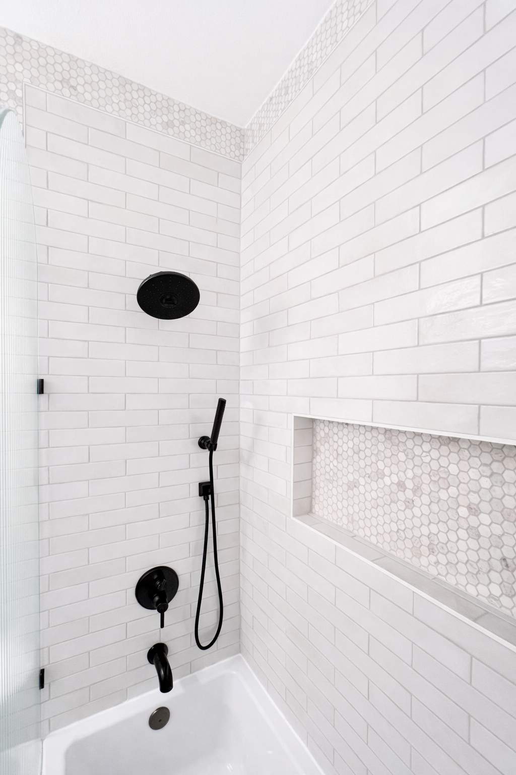 Stone Oak Hall Bathroom Remodel with Pink Vanity and Curved Shower Glass by Legacy Bath and Kitchen