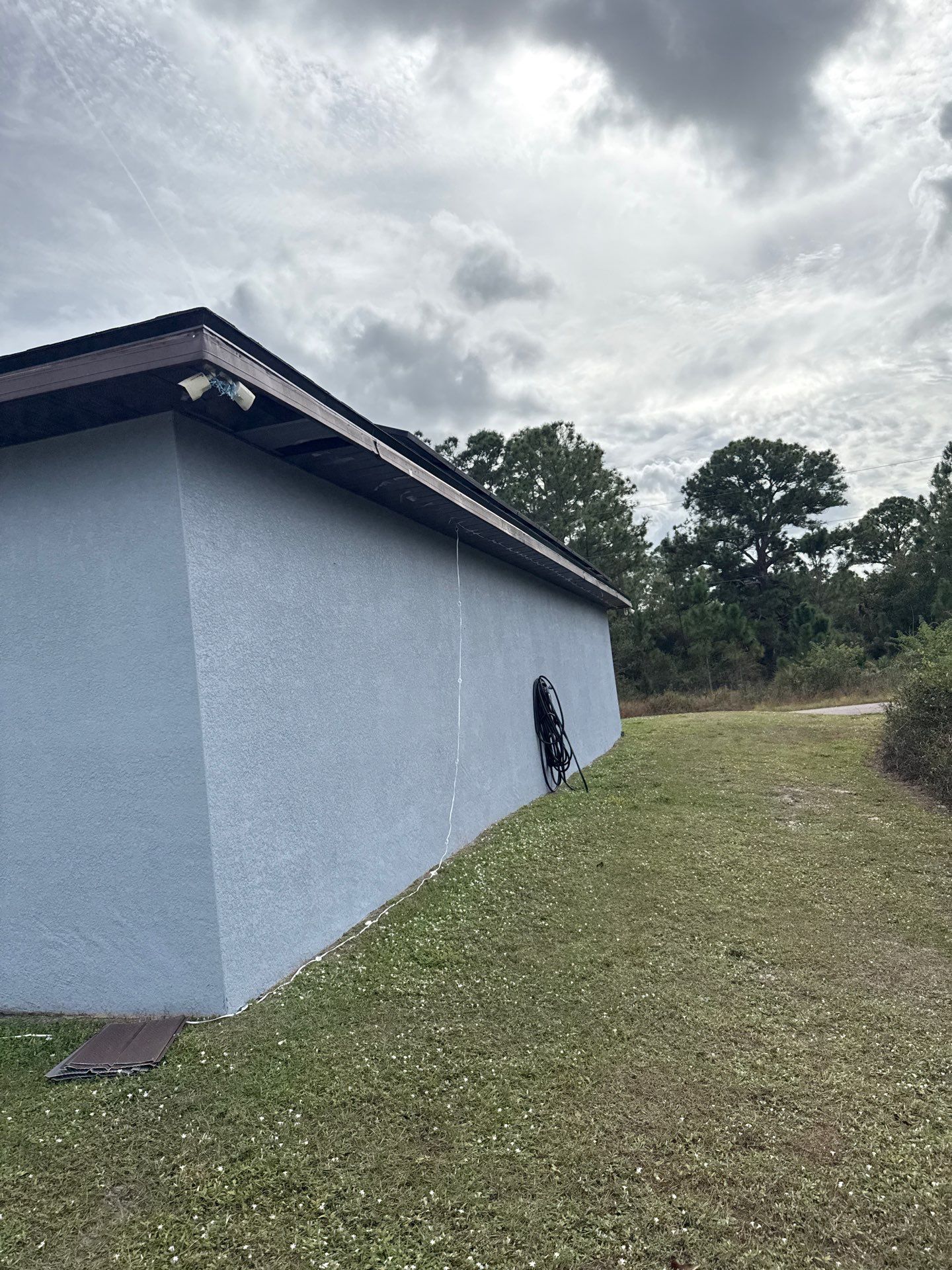 Black Seamless Gutters & Soffit/Fascia in Lehigh Acres FL by Gutter Professors