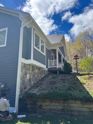 Seamless Gutter and Downspout Replacement for Suttons Bay Residence
