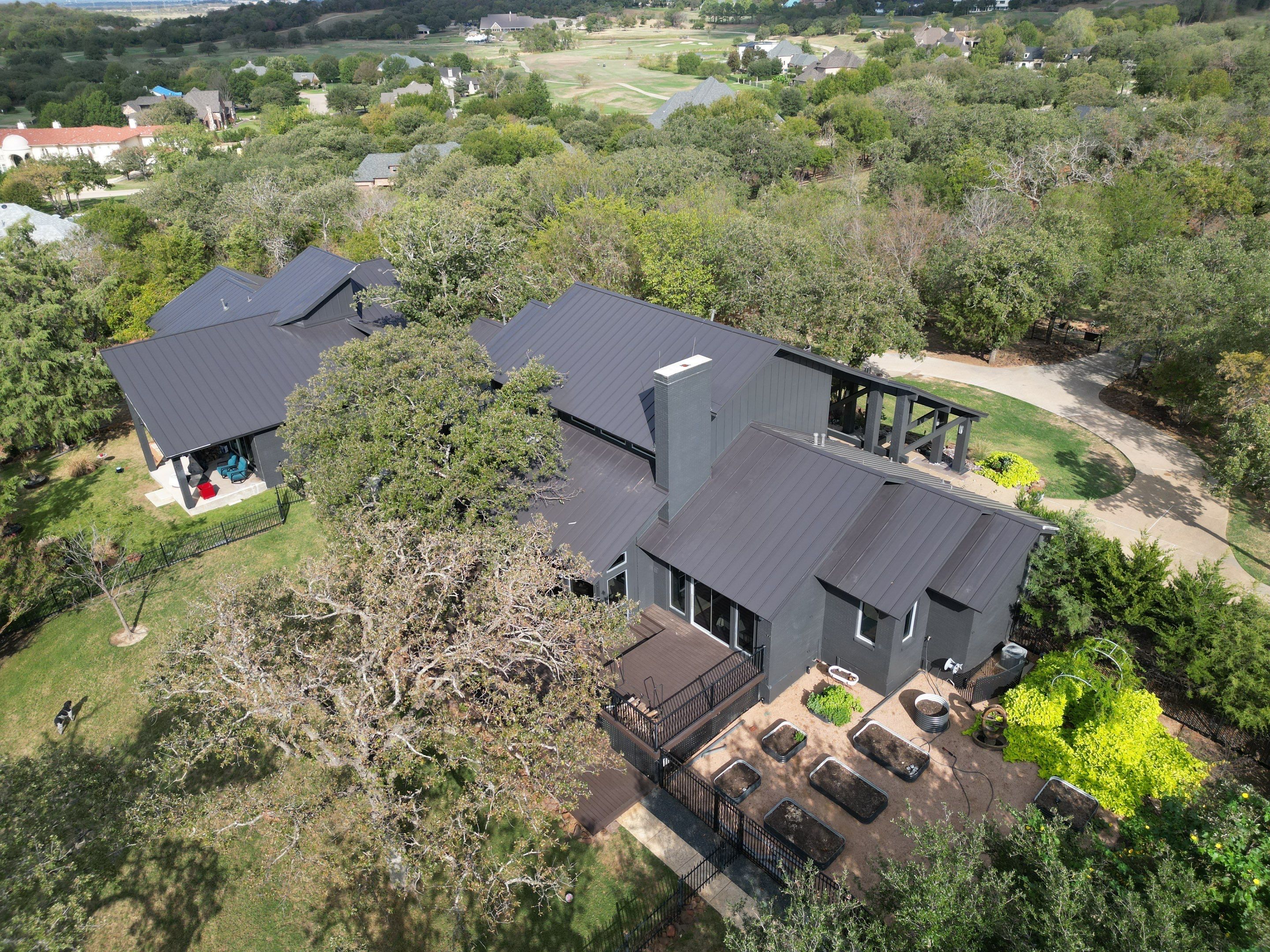Dark Bronze Standing Seam Metal Roof by First Out Roofing 