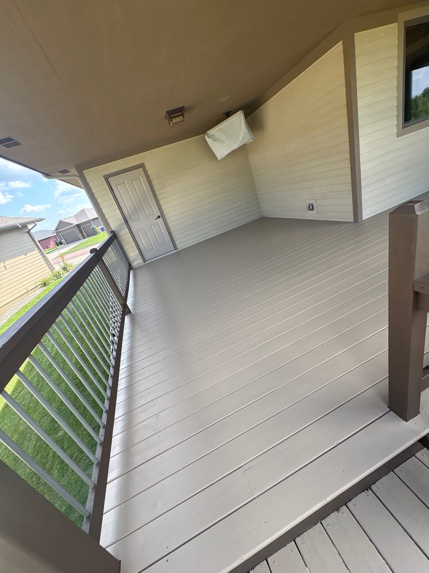 Sioux Falls Exterior Refresh and Multi-Level Deck Maintenance by Select Painting, Coatings & Garage Cabinets