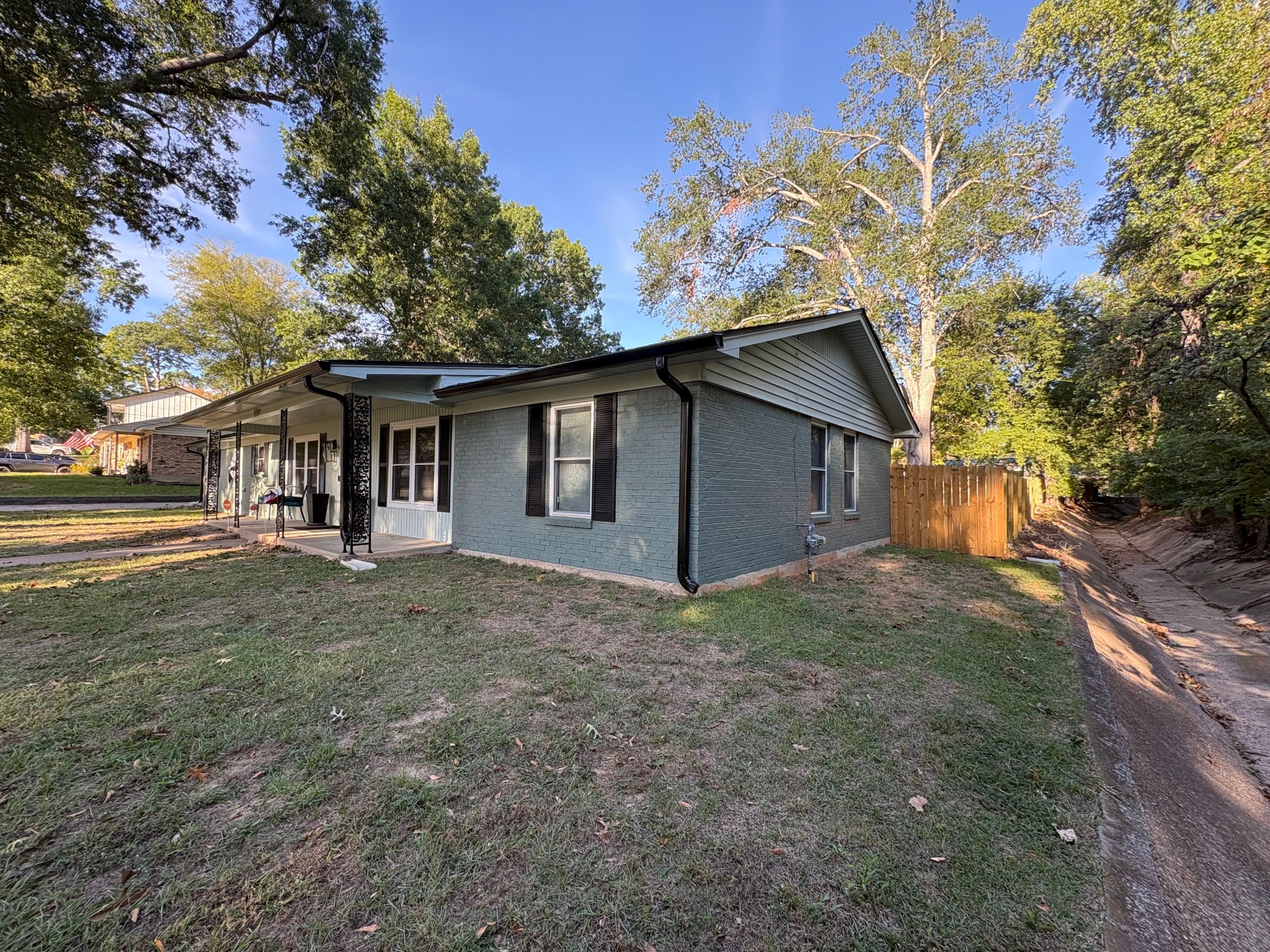 From Basic Brick to Bold Sage Green in Tyler, TX! Quality Coats Painting by Quality Coats Painting