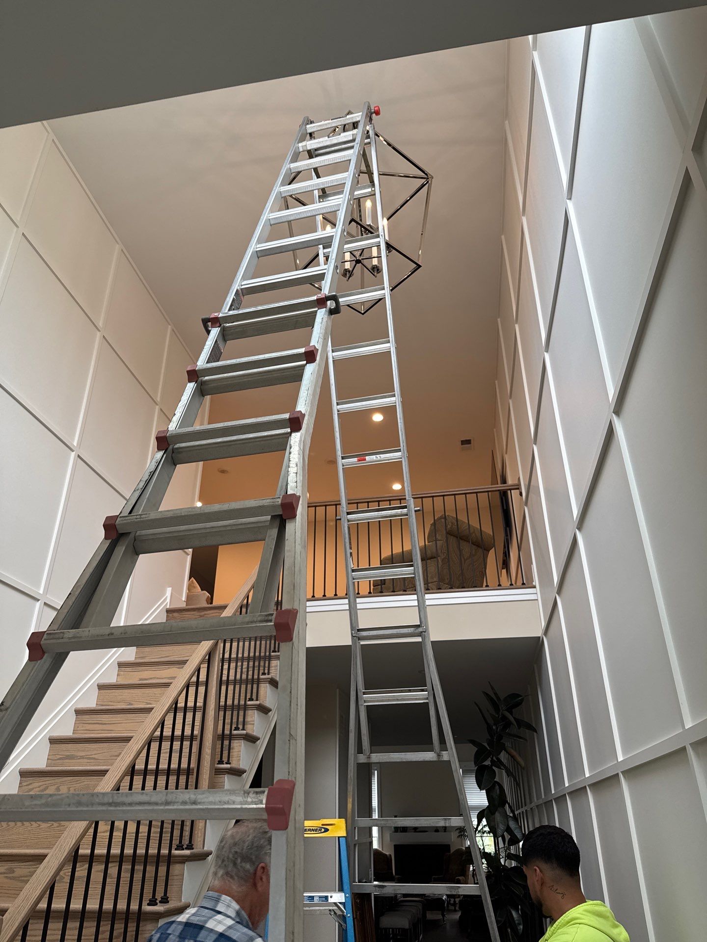 ZAM Installs Statement Light in Tall Entryway by ZAM Electric