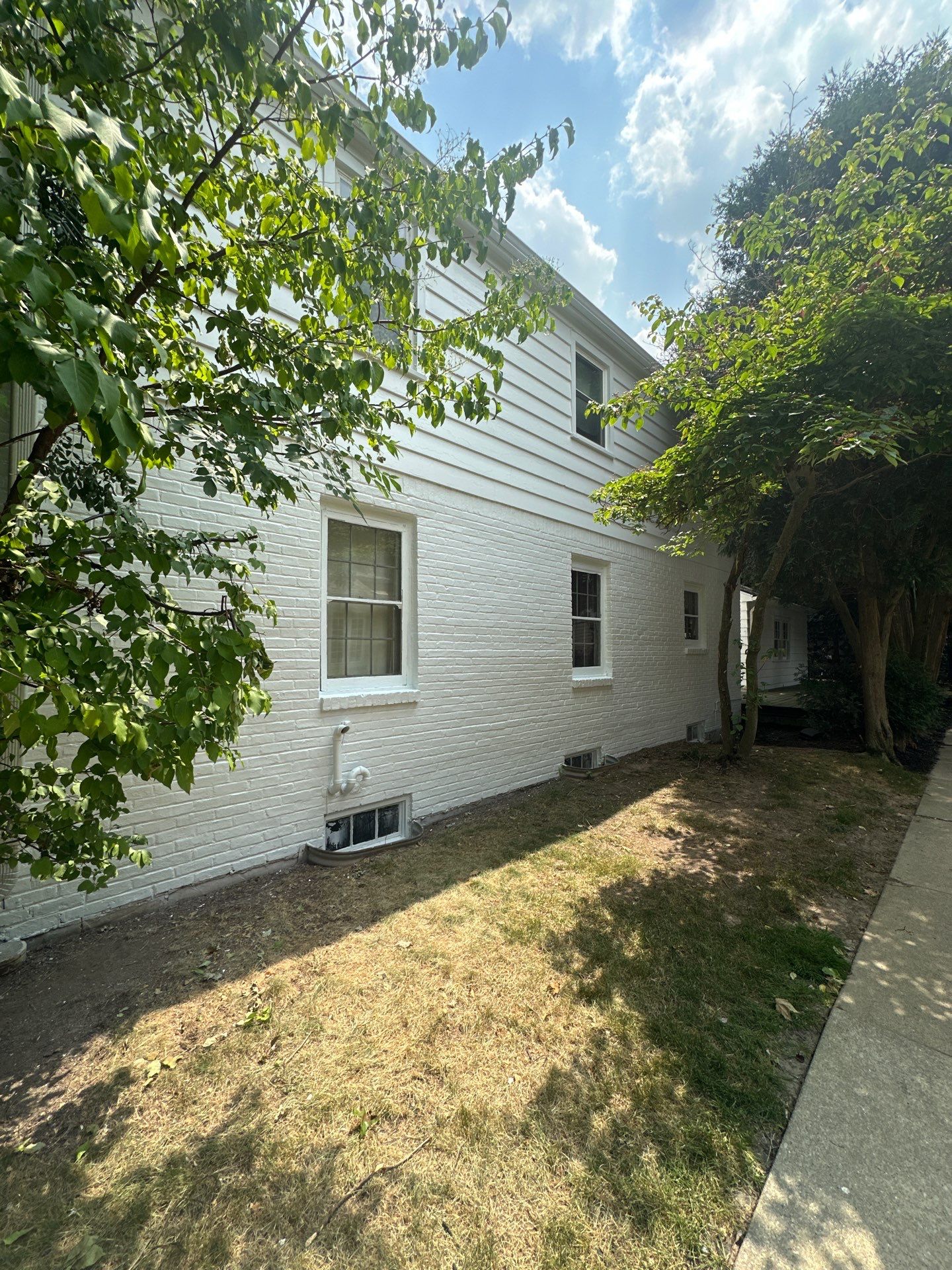 Shorewood Exterior Painting and Siding Refresh With Contrast Trim by OCS Contracting Services