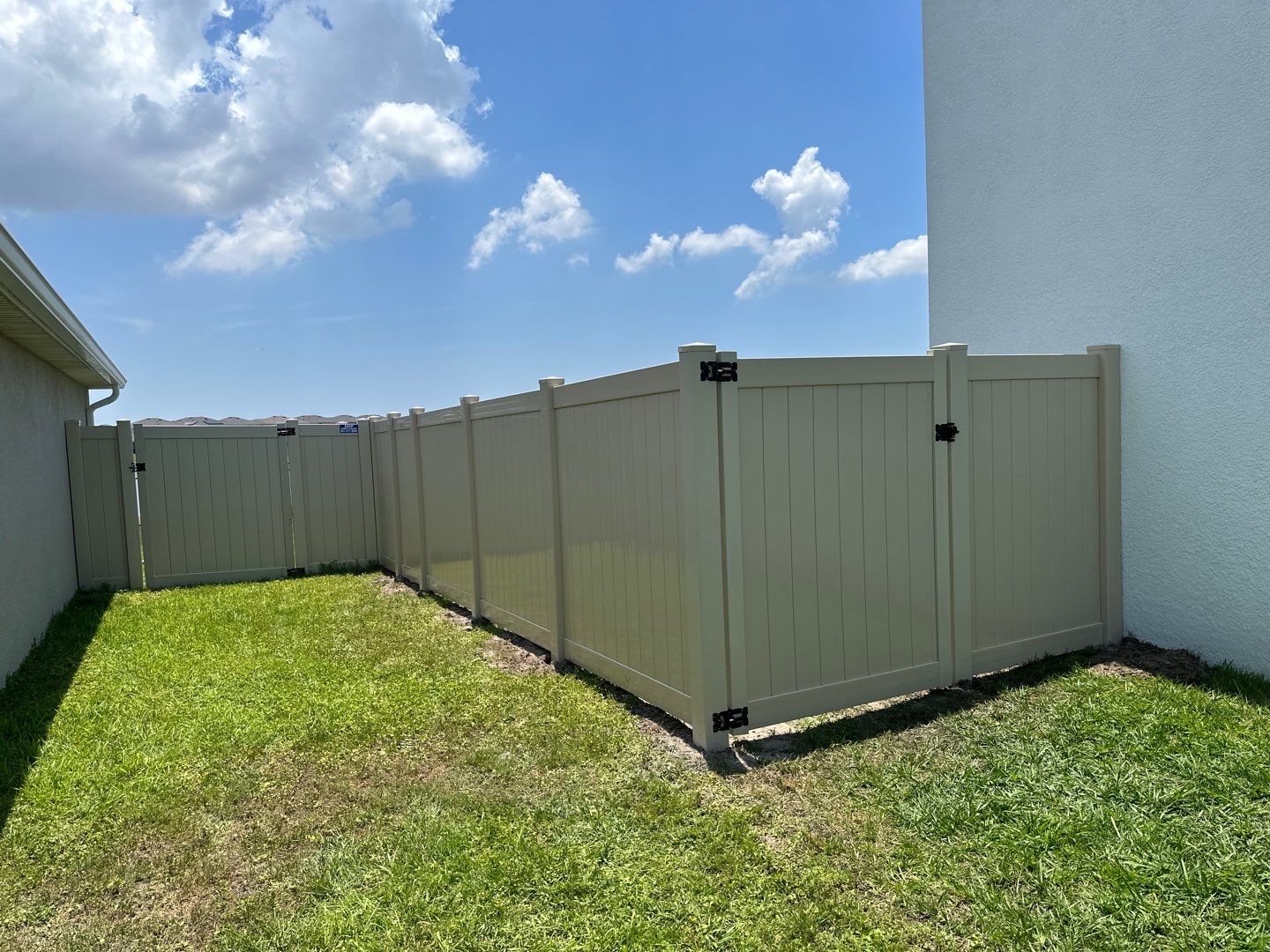 Aluminum Fence Installation using Black 3 Rail Aluminum Fence and Tan Vinyl Privacy Fence by Asap fence and gates, LLC