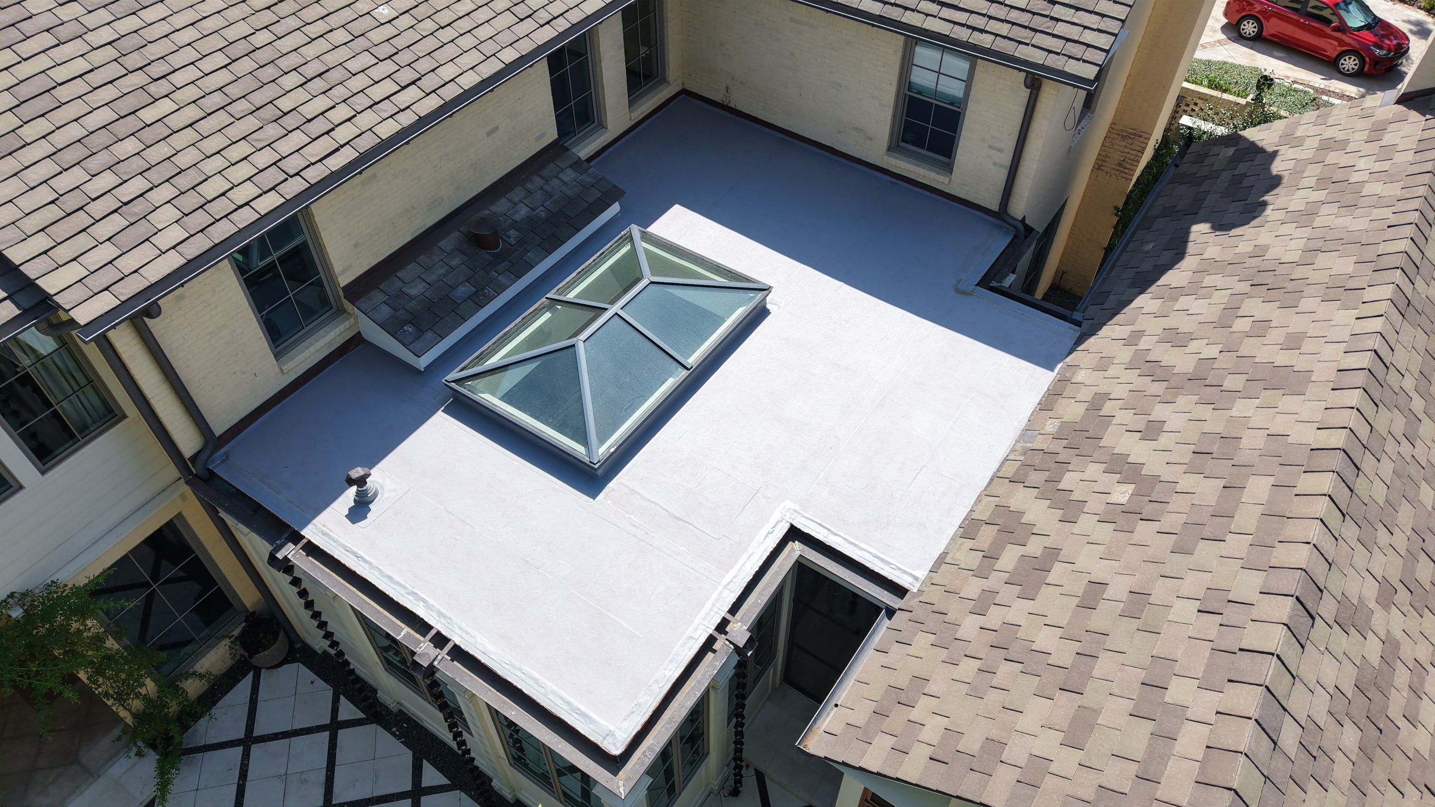 Residential Re-Roof for Flat Portion using Mule Hide .60 TPO by TEC Roofing