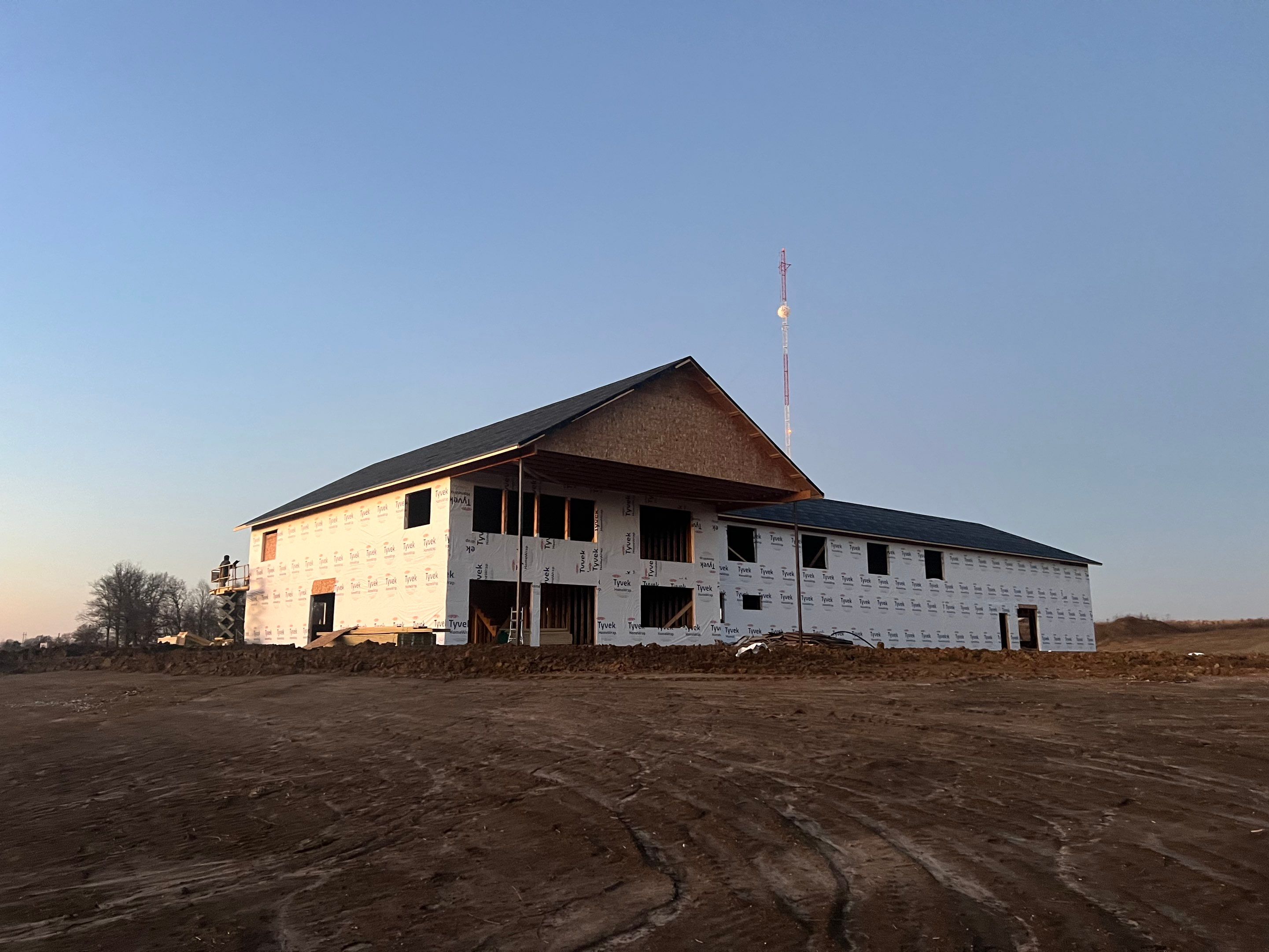New Home construction w/ board and batten sides and metal roof  by Miles Construction 