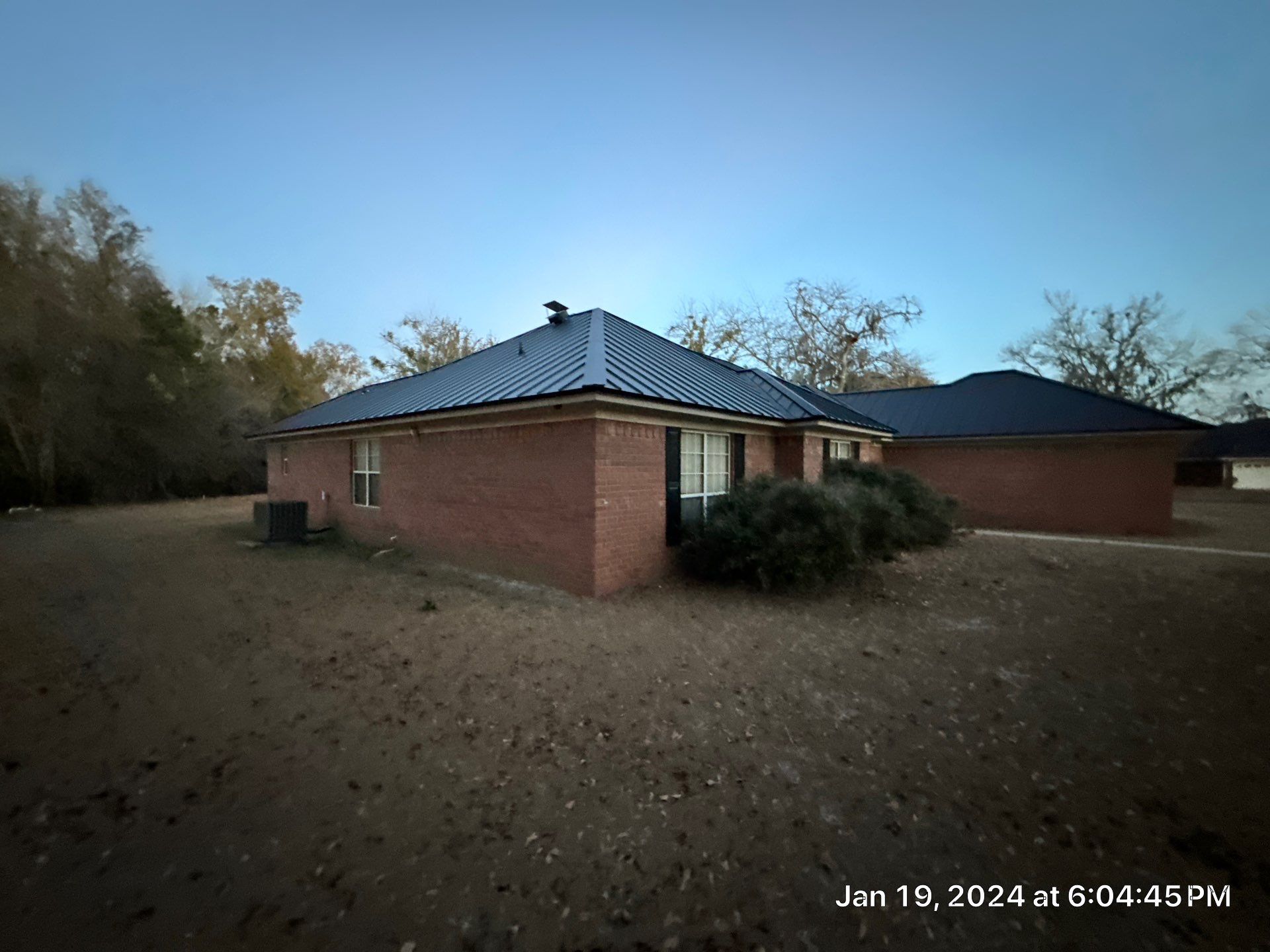 Residential Roofing Installation using Benton 26Ga 1inc Snapcock Metal Roof KYNAR Matte Black by Talya Roofing
