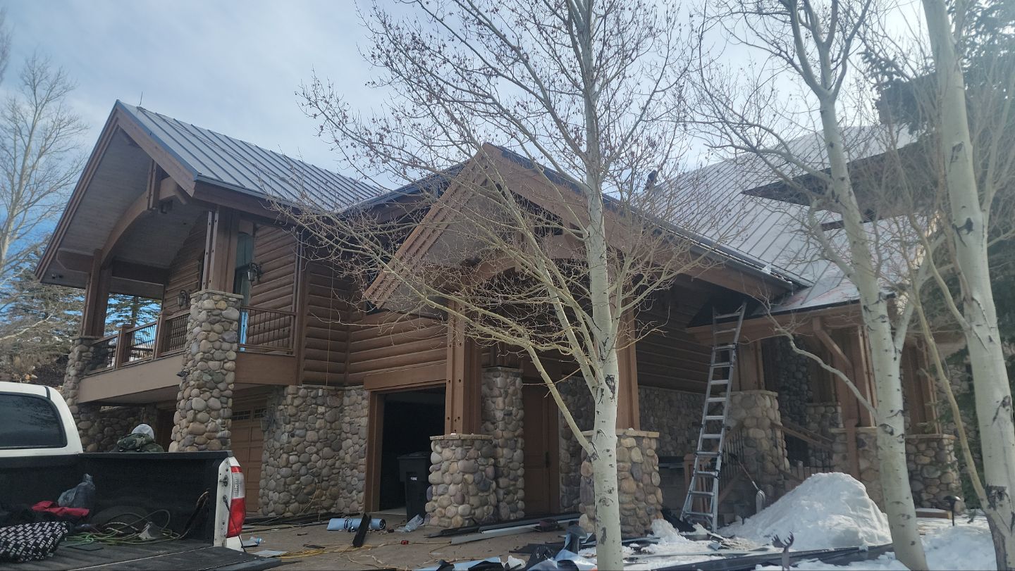 Standing Seam Metal Roof Replacement After Snow Damage by ASAP Roofing & Restoration
