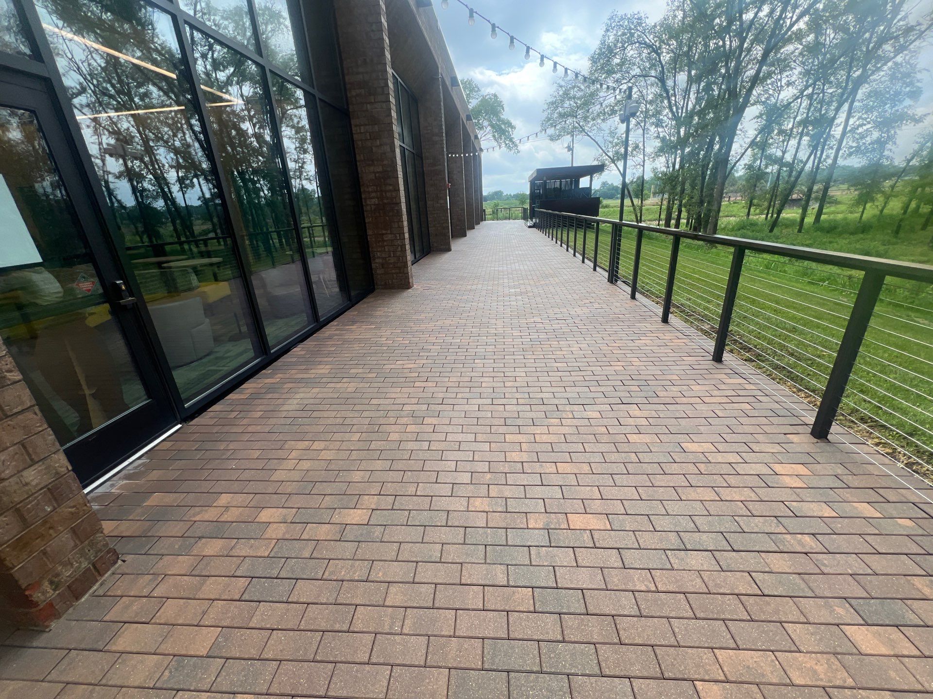 Brick paver repair, cleaning, sealing and poly sanding by Northern Power Washing LLC.