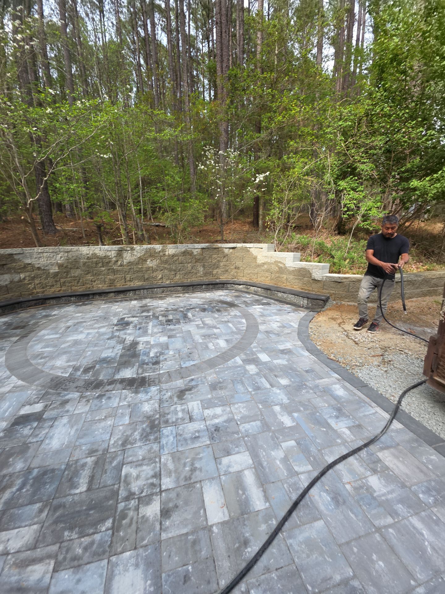 Pittsboro Outdoor Living Transformation – Retaining Wall, Paver Patio & Elevated Deck by Elite Remodeling and Design LLC