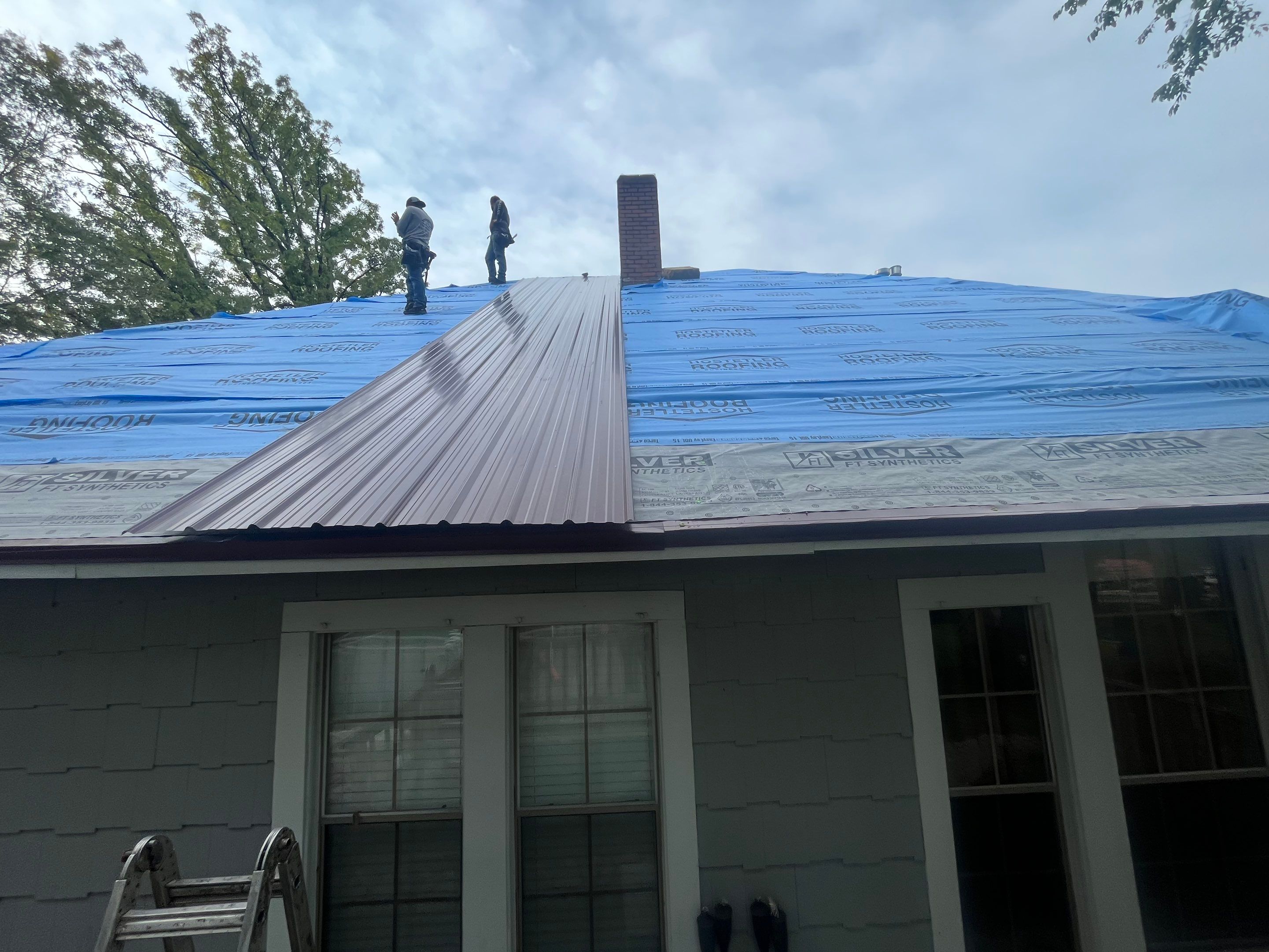 Residential Metal Roof Replacement using Reed's Metals: Colored Residental Panel (Burgundy) by Hostetler Roofing