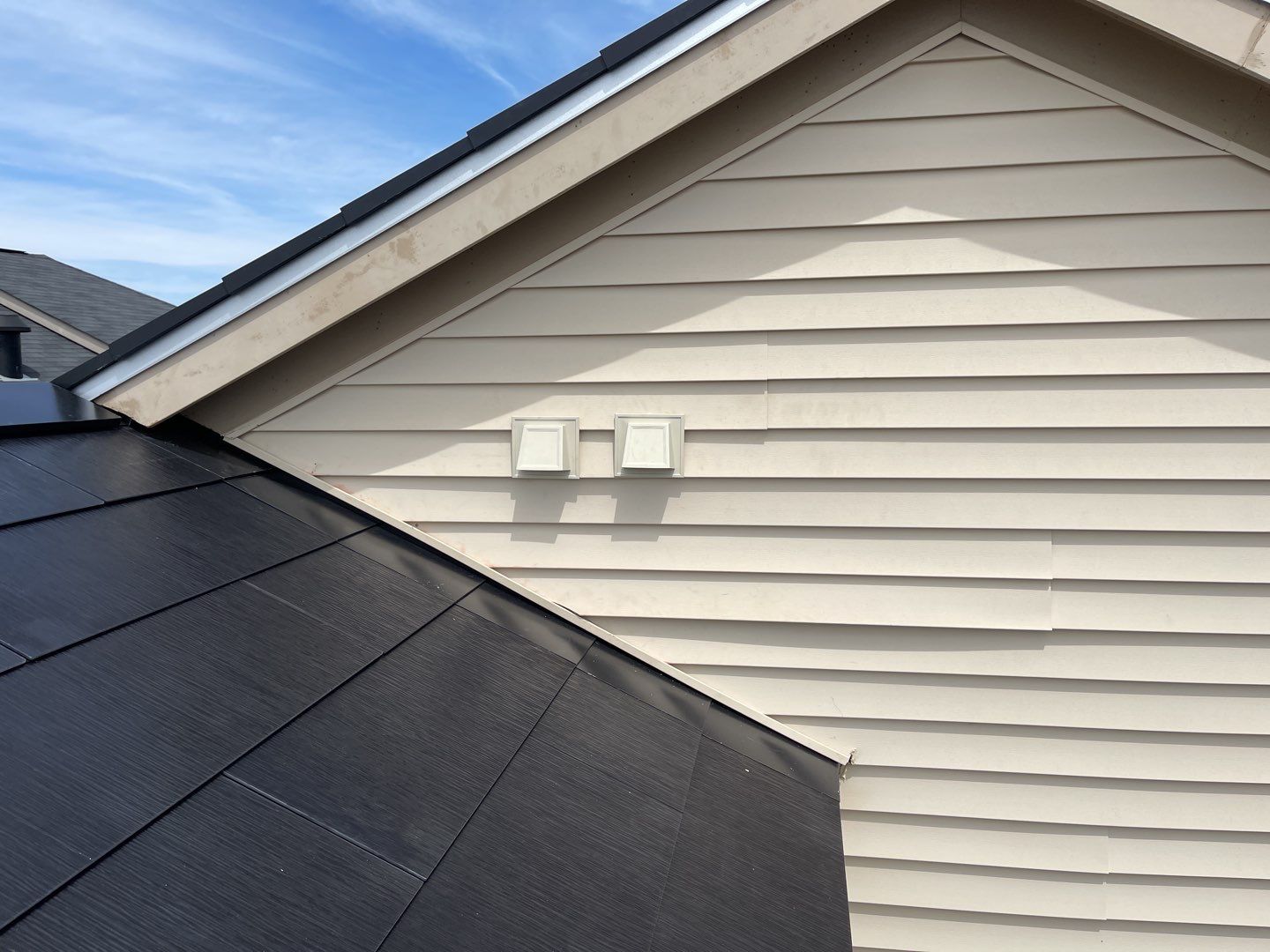 Tesla Solar Roof using Tesla Solar Roof V3 tiles by American Home Contractors