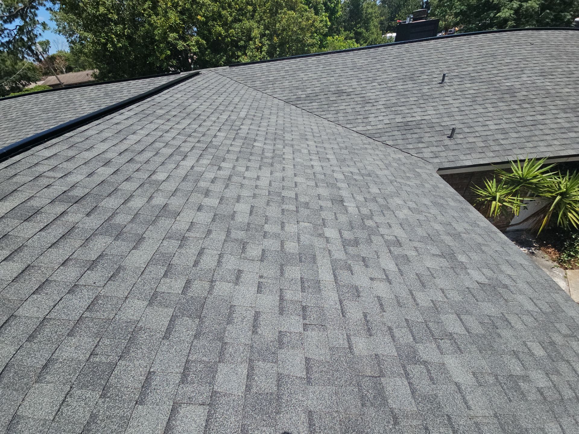 Roof Replacement with Architectural Shingles and Chimney Repair in Cocoa by Wiedmann Construction & Roofing