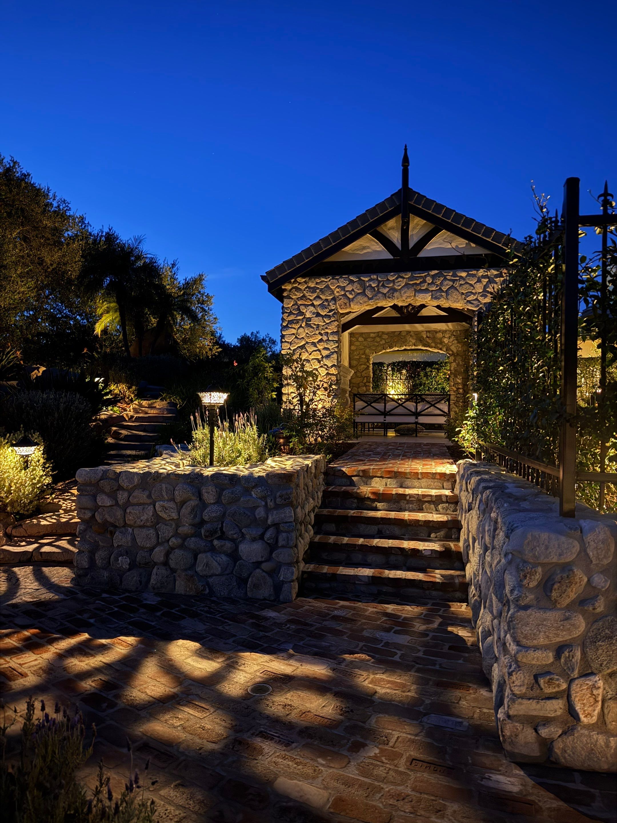 Tudor Estate Landscape Lighting with Integrated Stone Step Illumination by Outdoor Lights + Shades