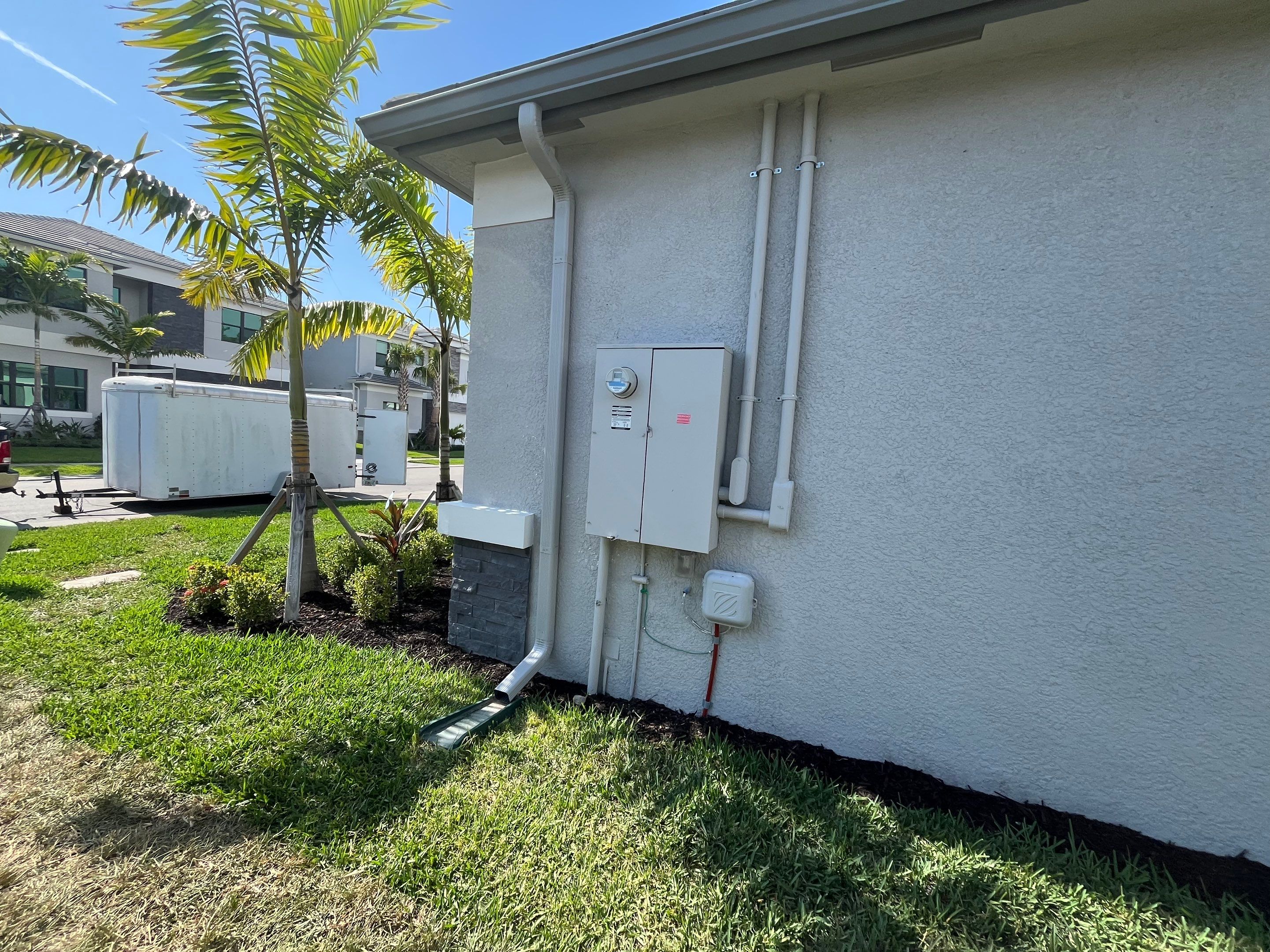 Grey Seamless Gutter Installation in Estero FL by Gutter Professors