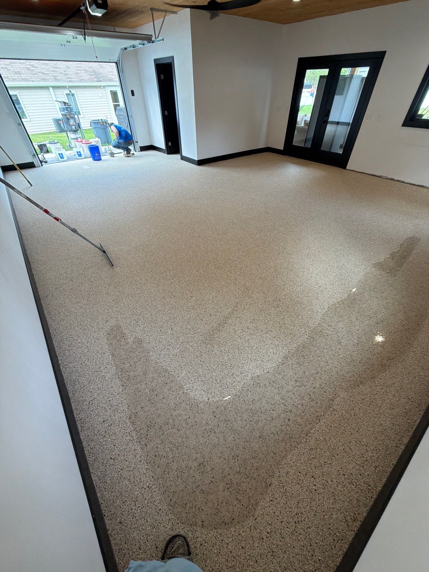 Multi-Room Epoxy Flake Floor Installation Throughout Pentwater Residence by Gordon Painting